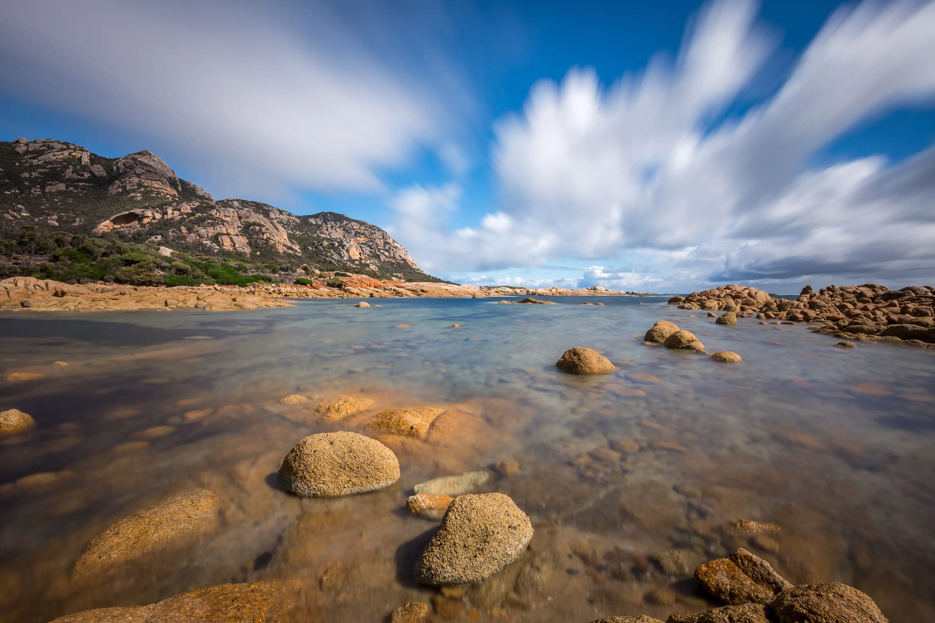 Incredible wide angle image of The Dock, Flinders Island on a clear, sunny day. Where the mountains meet the coastline. 