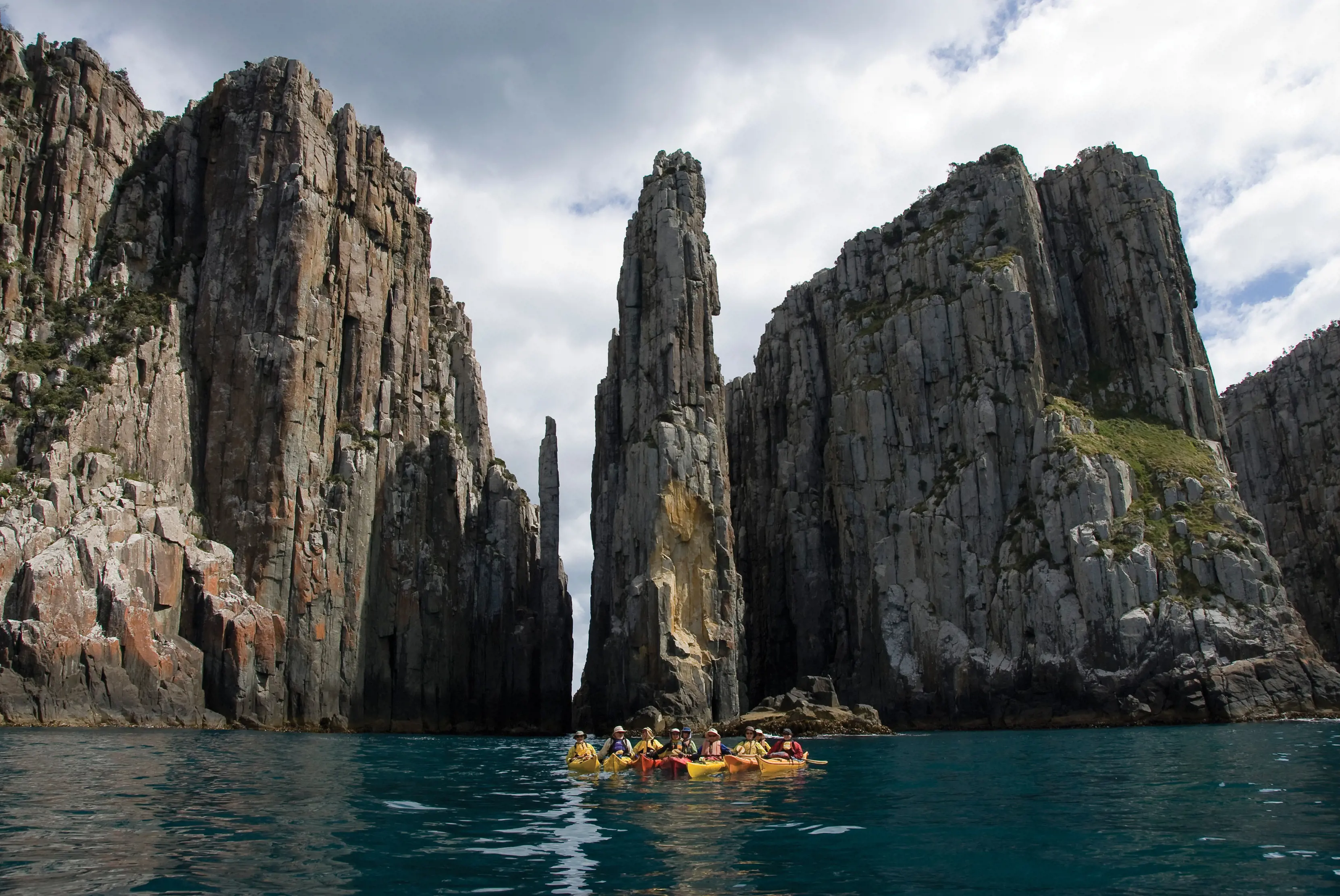 Group of friends experiencing the Roaring 40's Ocean Kayaking sea kayaking eco-tour around the Turrakana / Tasman Peninsula.