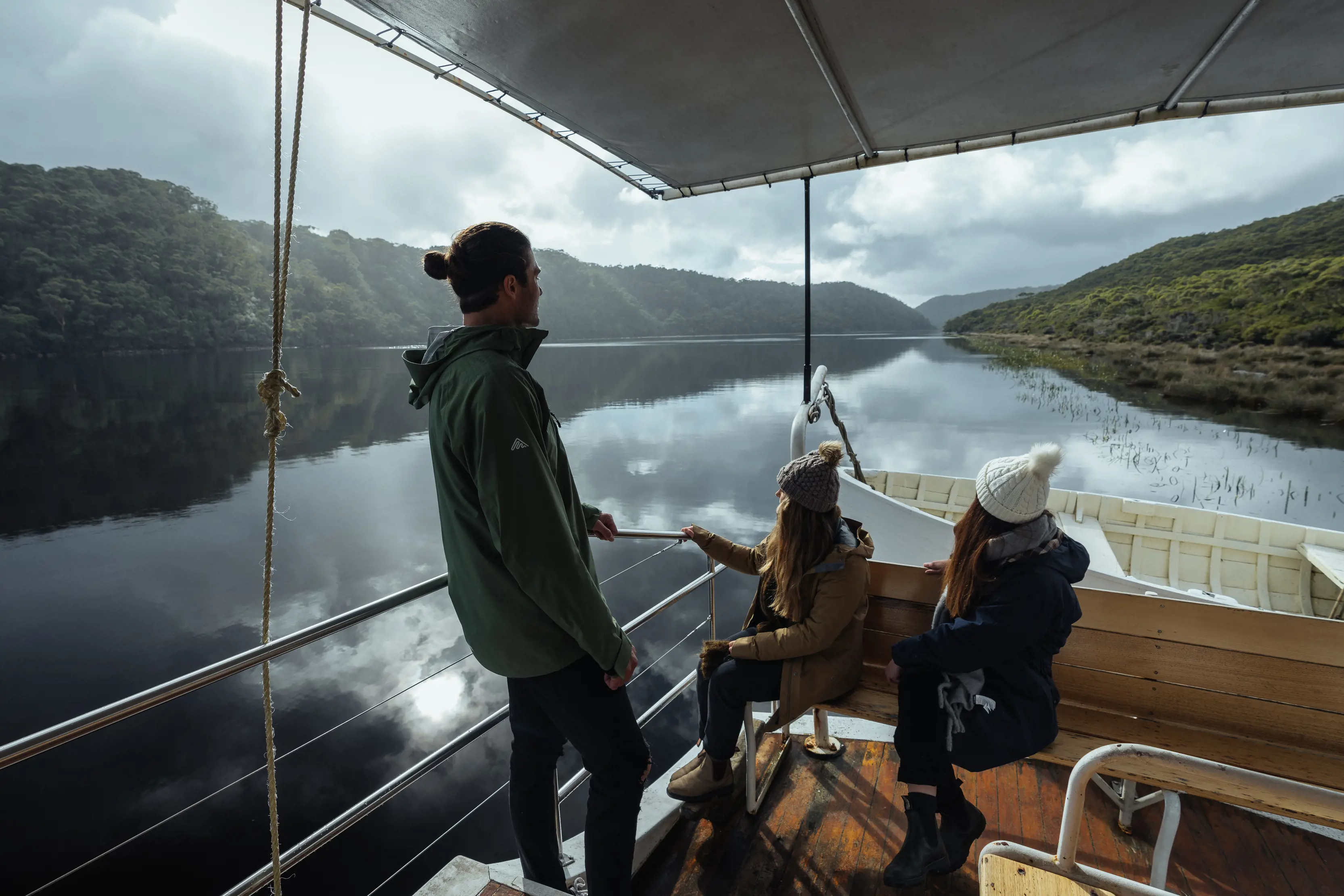 Three people on a Pieman River Cruise at the southern end of of the Takayna / Tarkine wilderness area. 