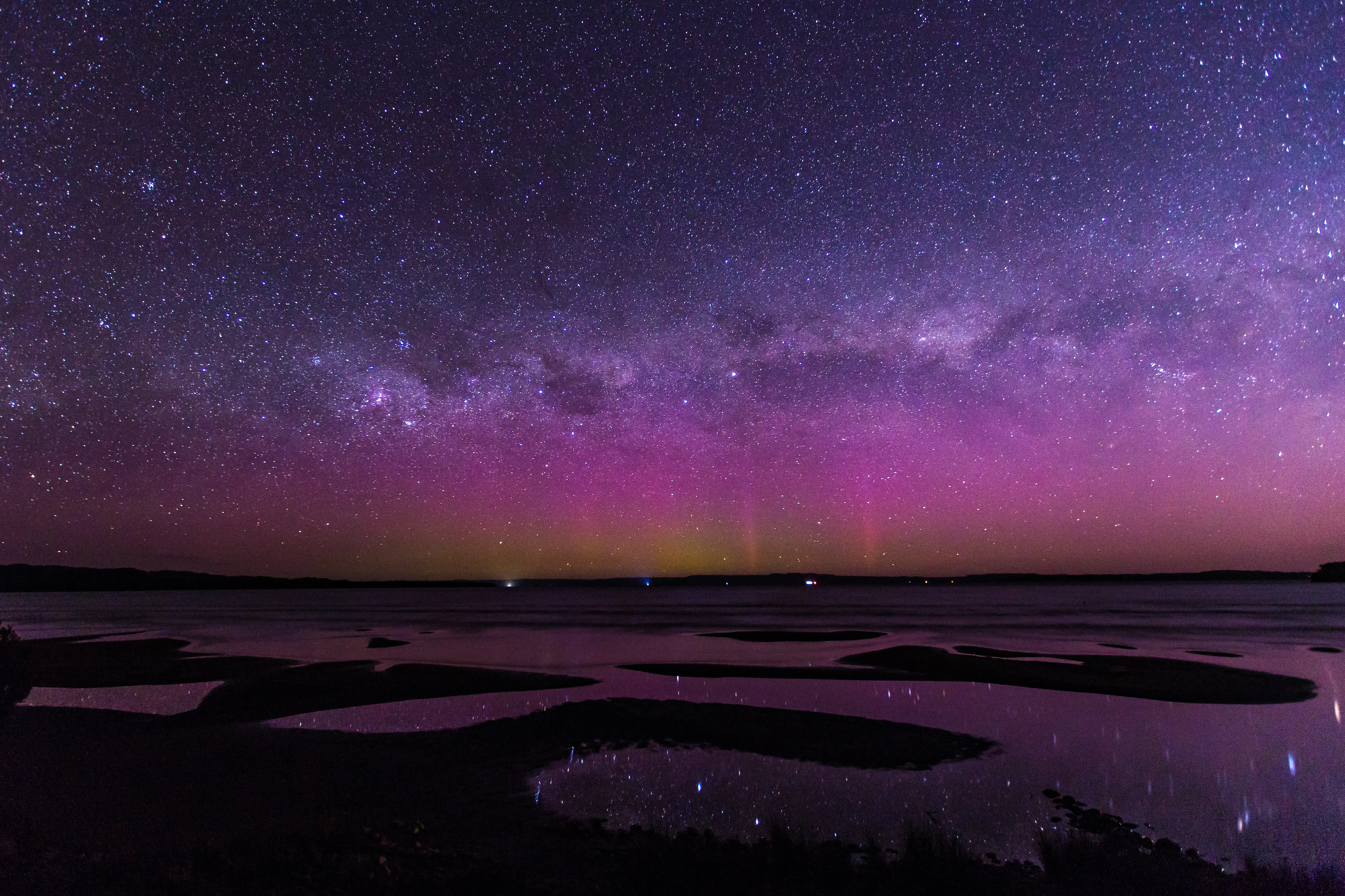 Aurora Australis illuminating the light sky purple in Strahan