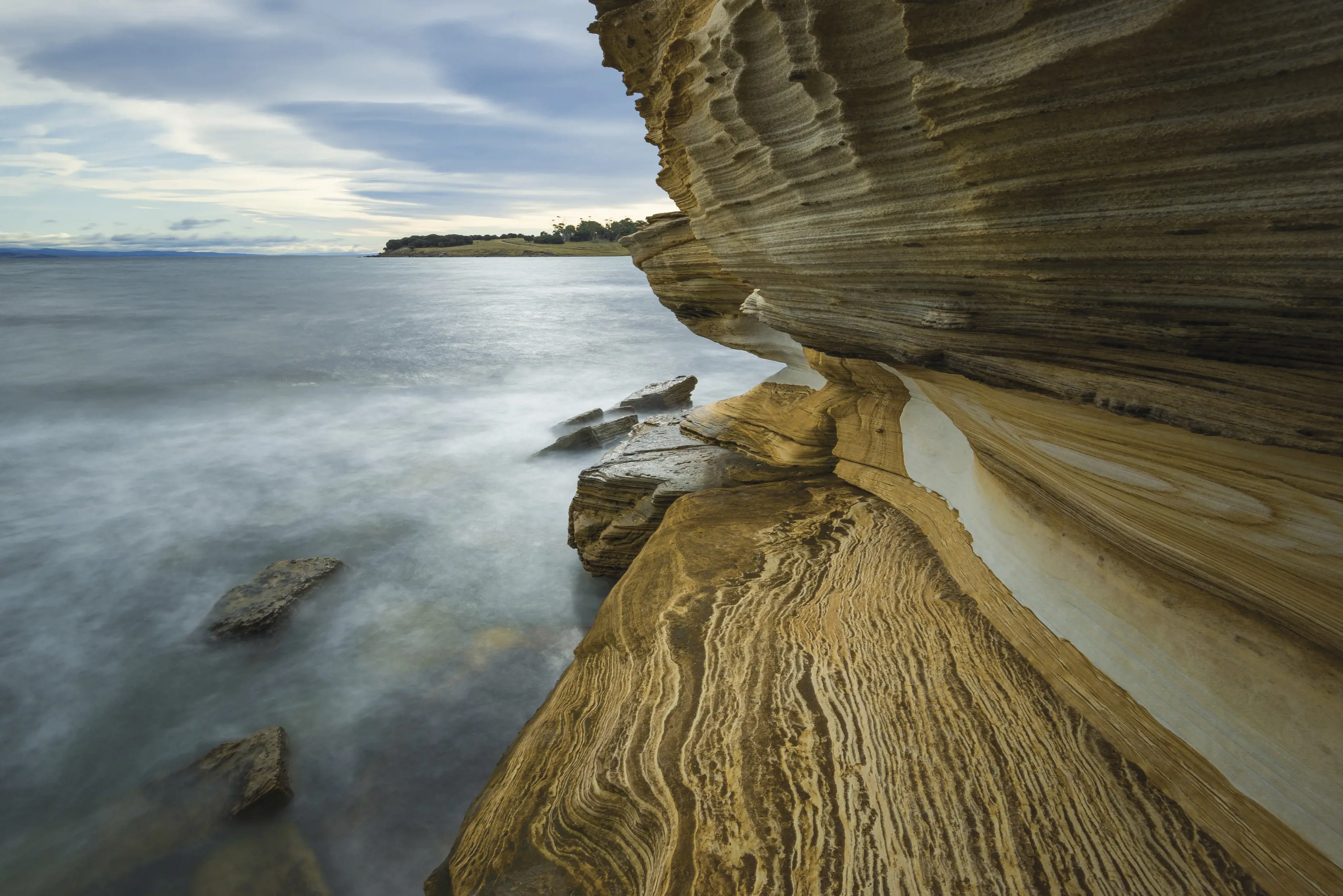Painted Cliffs, coloured and patterned sandstone, carved and moulded by the sea at Maria Island National Park