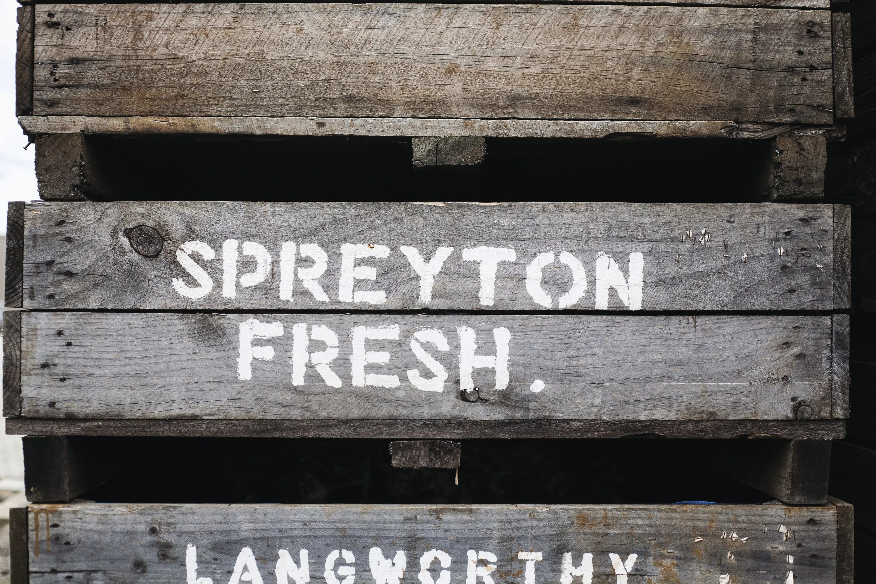 Spreyton Fresh signage painted on wooden panels. 