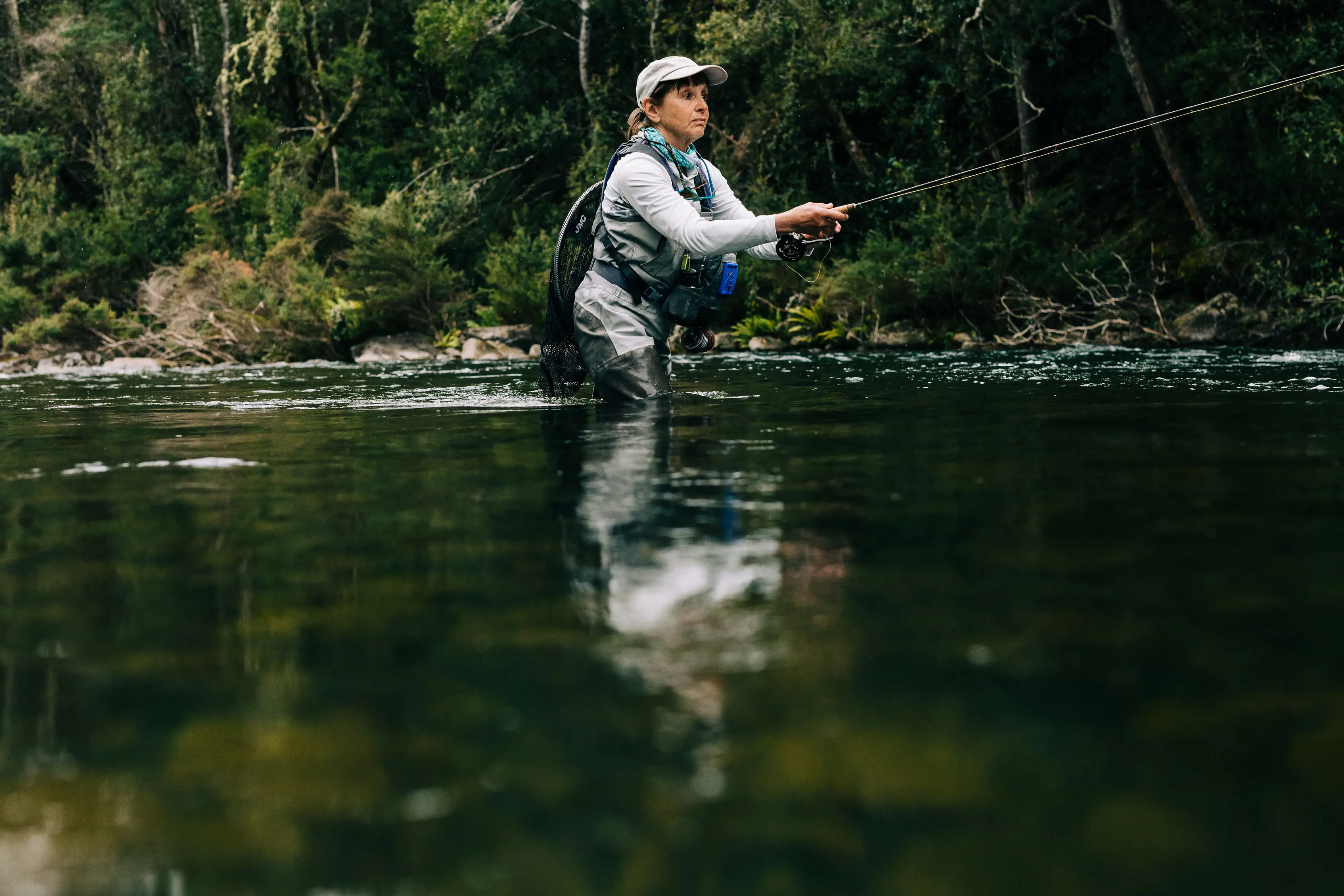 Woman fly fishing on the Meander River