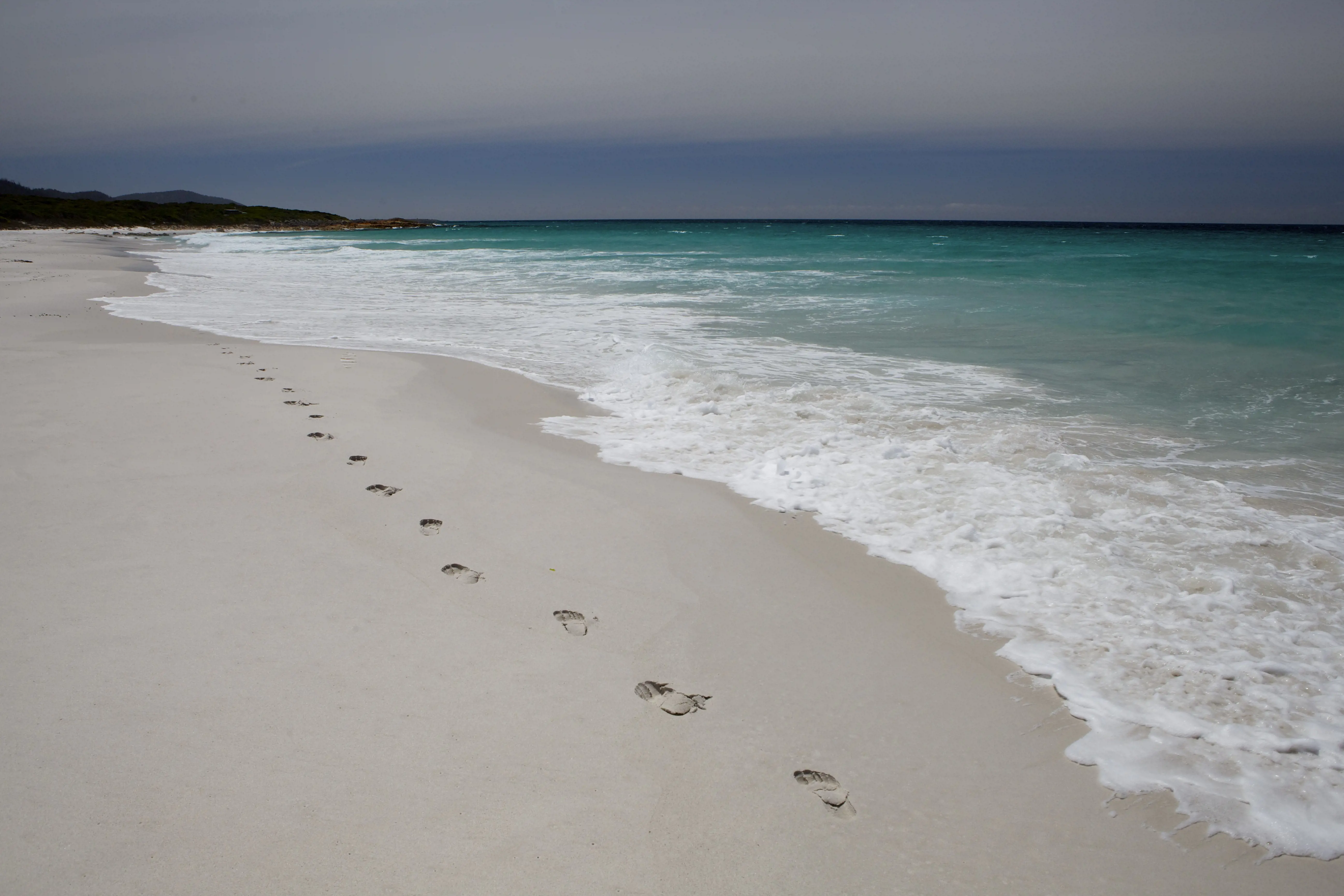 Footprints in the sand along Friendly Beaches, Freycinet National Park, Tasmania