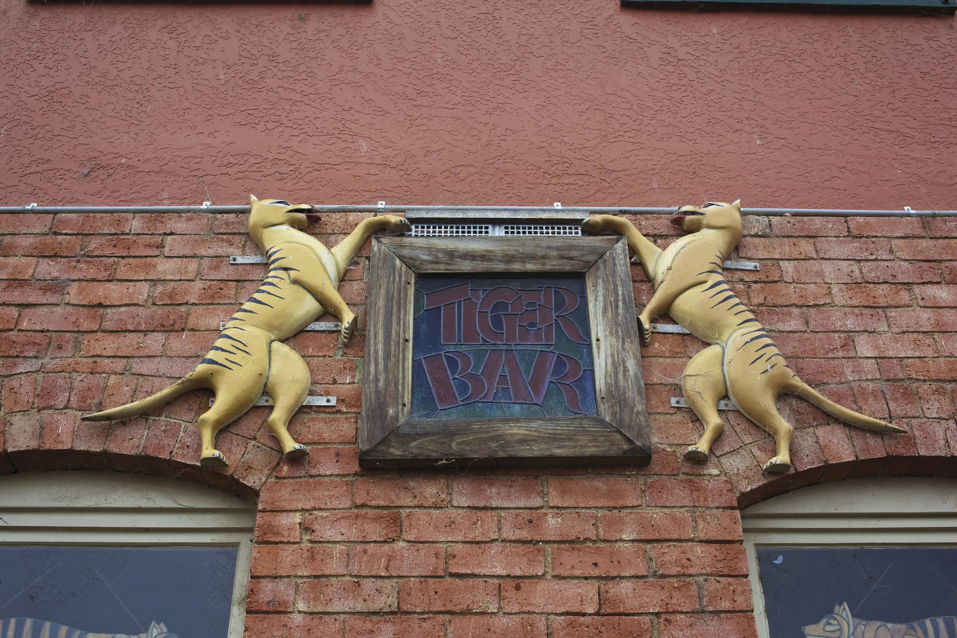 Exterior of the Tiger Bar entrance sign at Mole Creek Hotel. 
