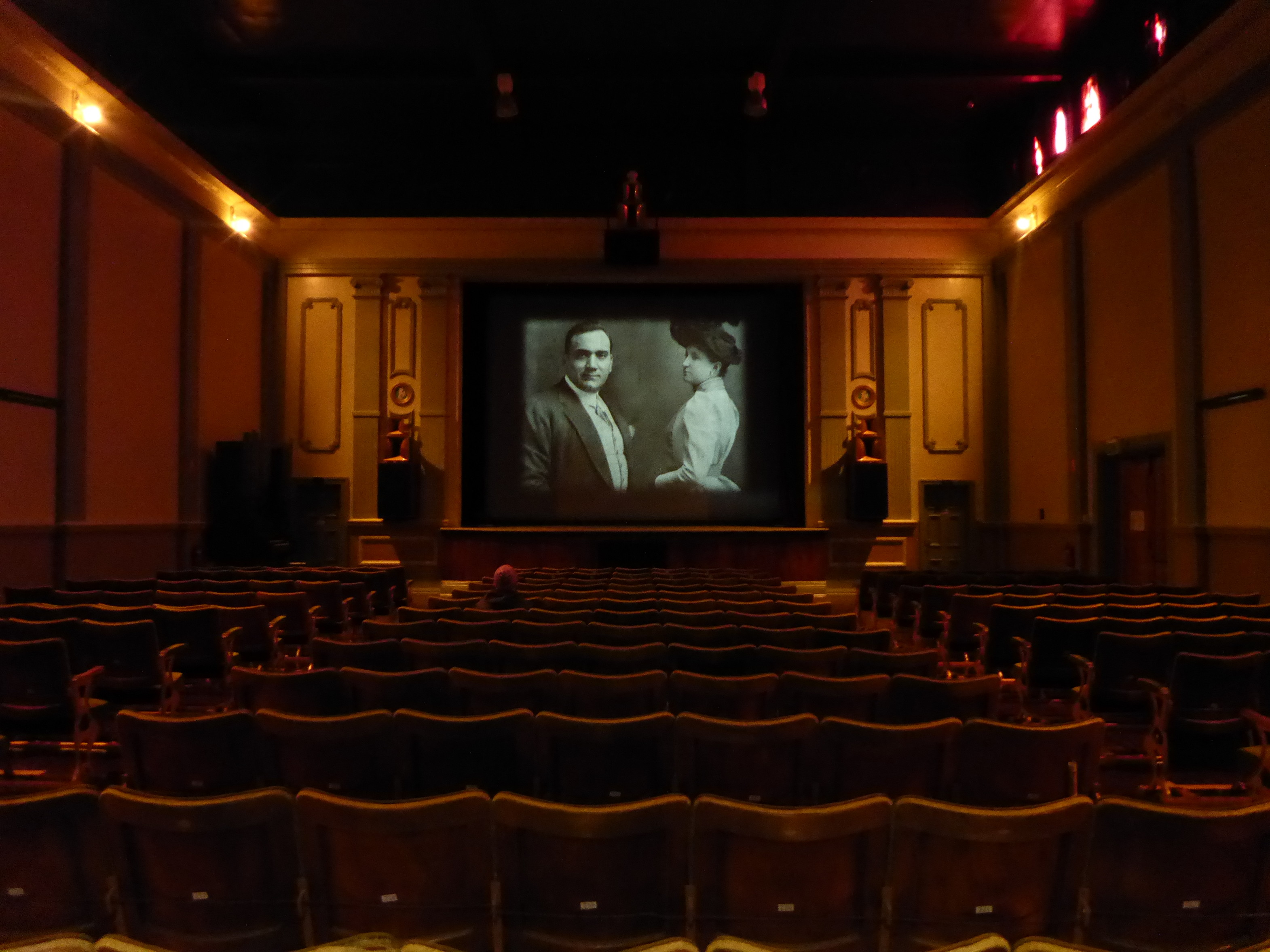 Interior of a person on their own seating facing the screen in Gaiety Theatre, Zeehan.