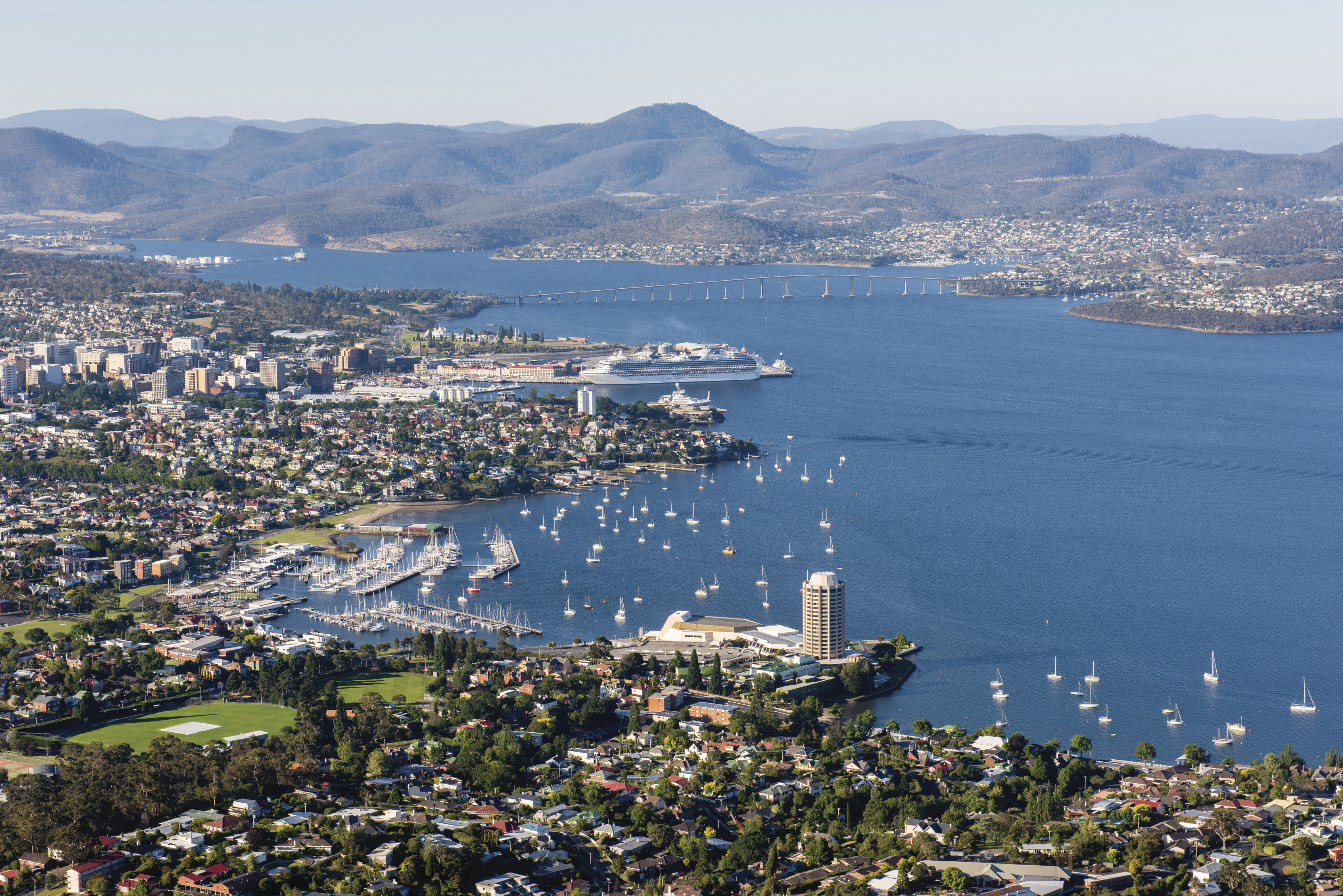 Aerial view of Hobart's stunning blue waters, city landscape and mountains.