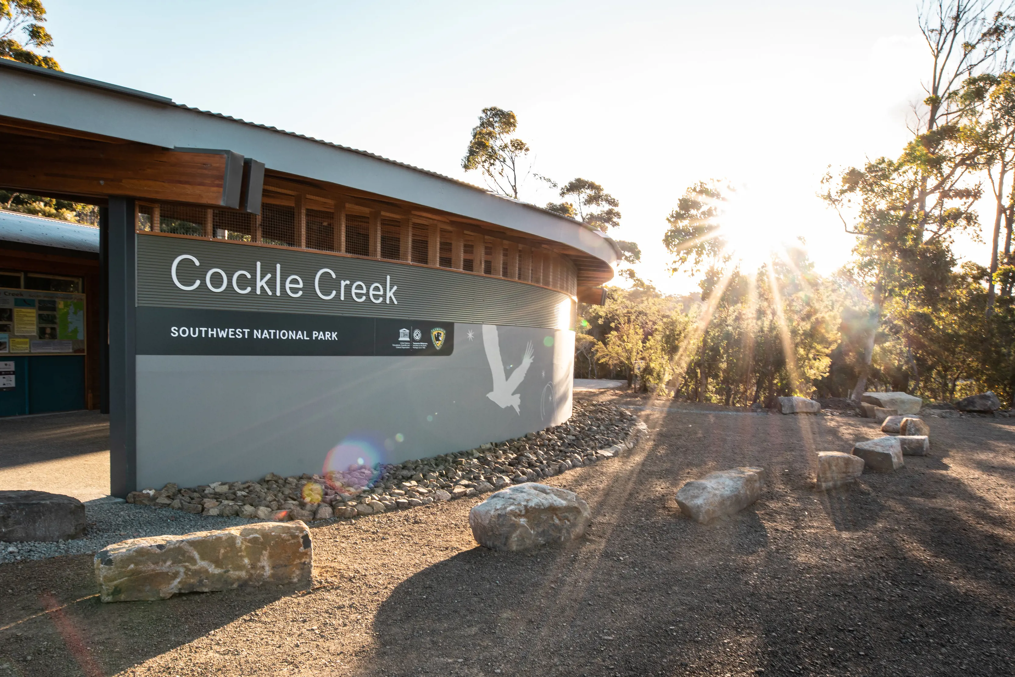 The sun beams over Cockle Creek Vistor Centre, at Southwest National Park.