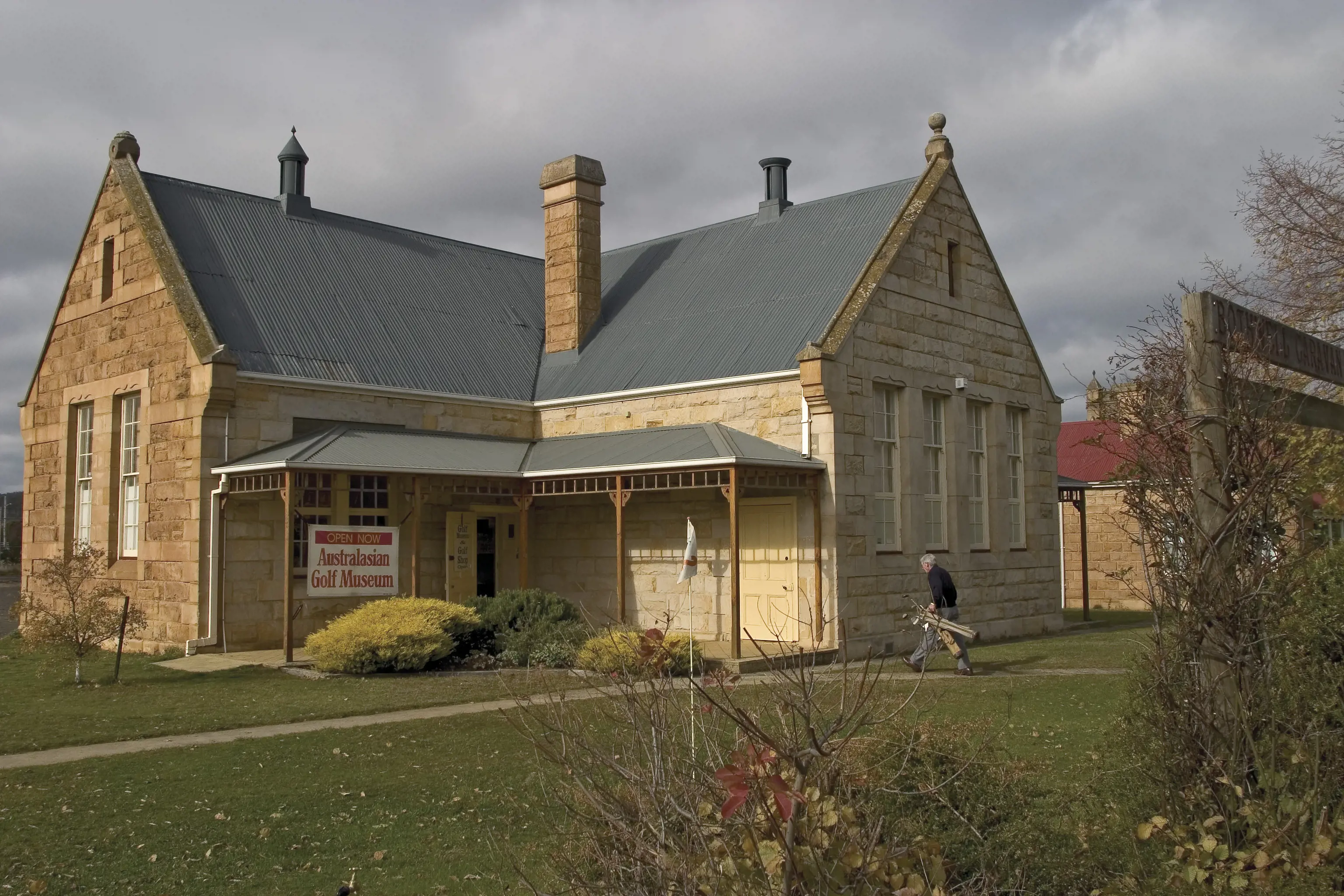 External image of a man walking towards the entrance at The Australasian Golf Museum, in Bothwell village.