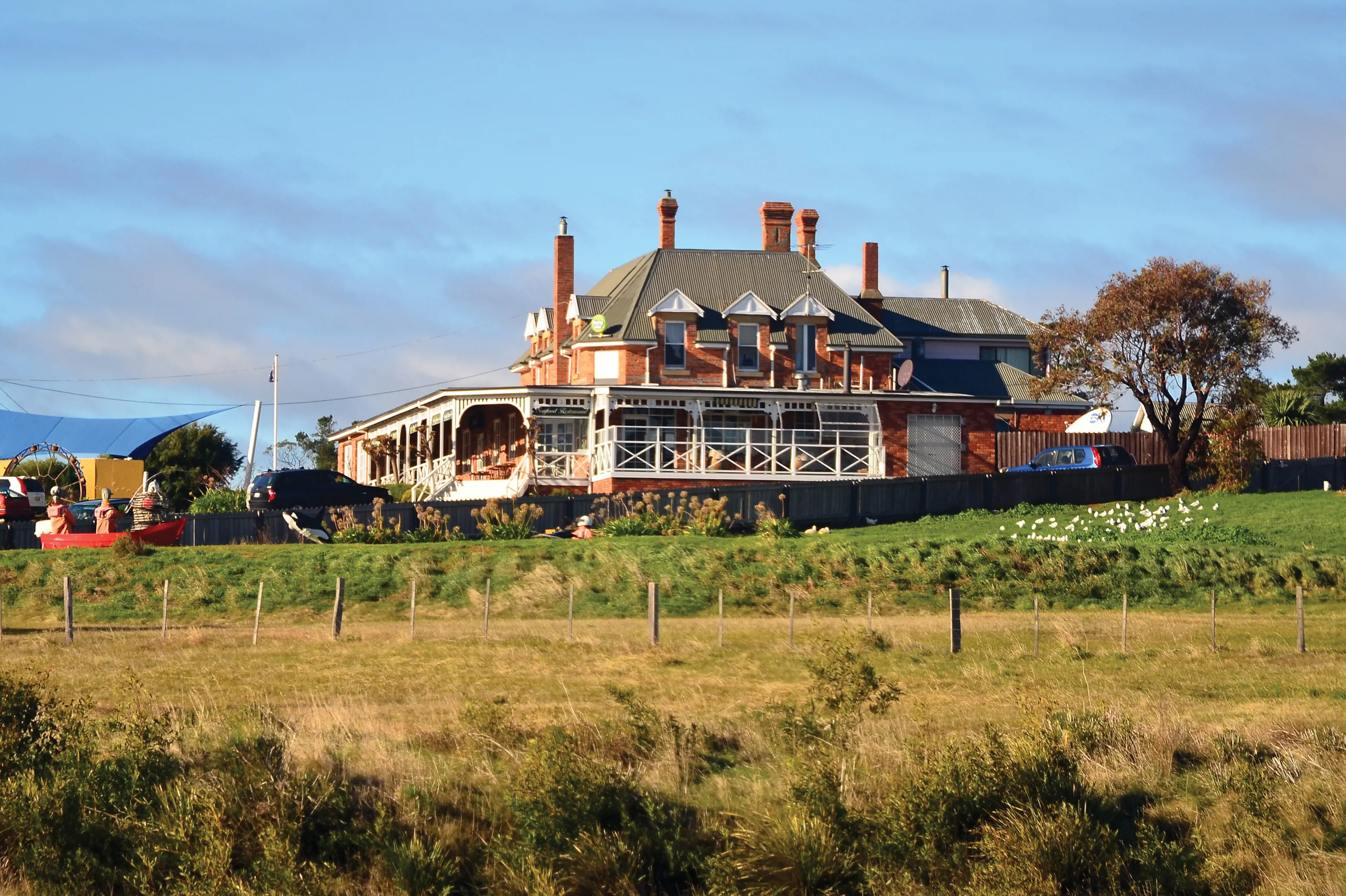 Exterior of Dunalley Hotel from across the surrounding fields.