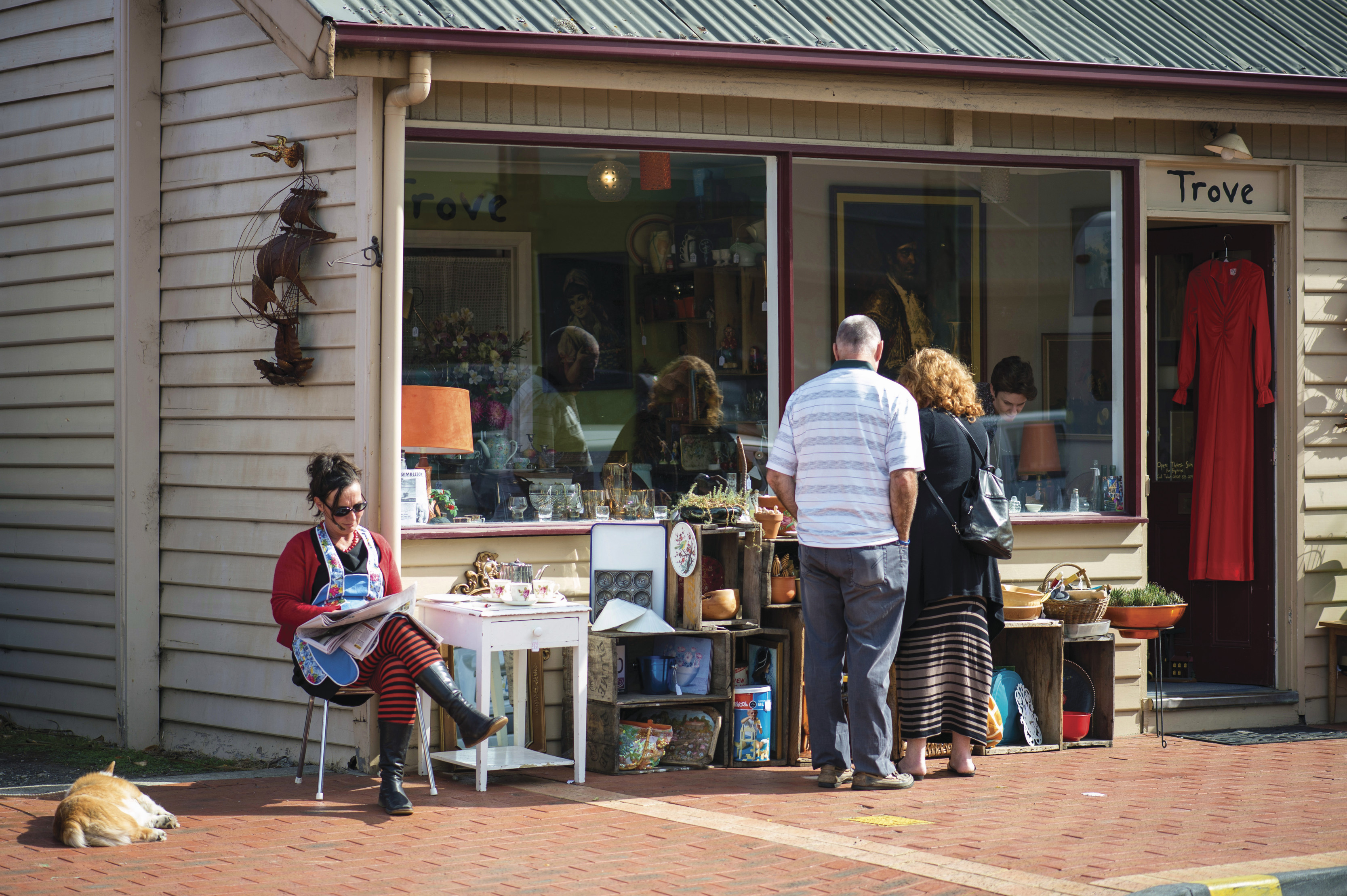 A couple browse the antiques and collectables outside Trove, a shop in Cygnet.