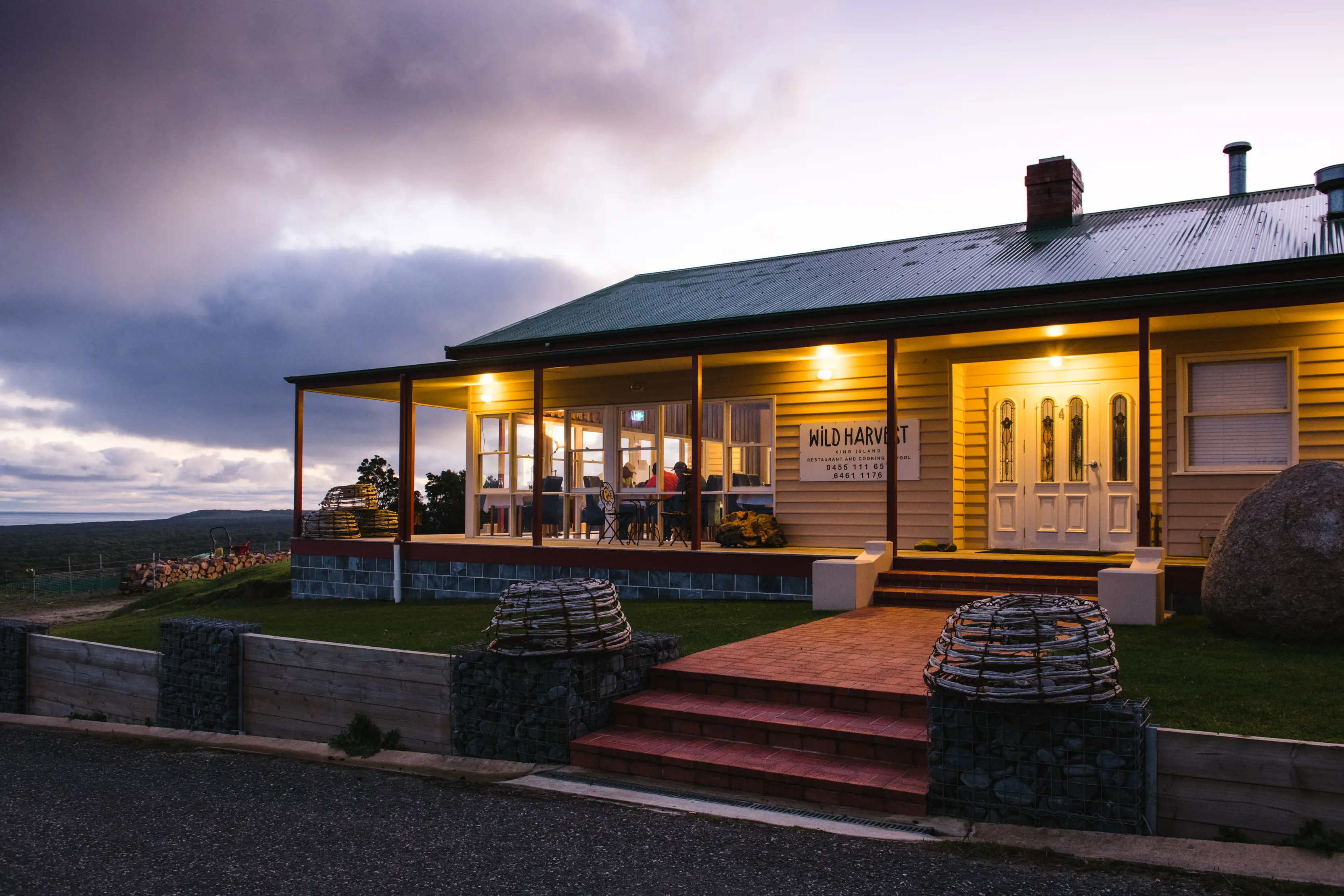 Incredible image of Wild Harvest Restaurant and Cooking School, a fine dining restaurant, taken at dusk.