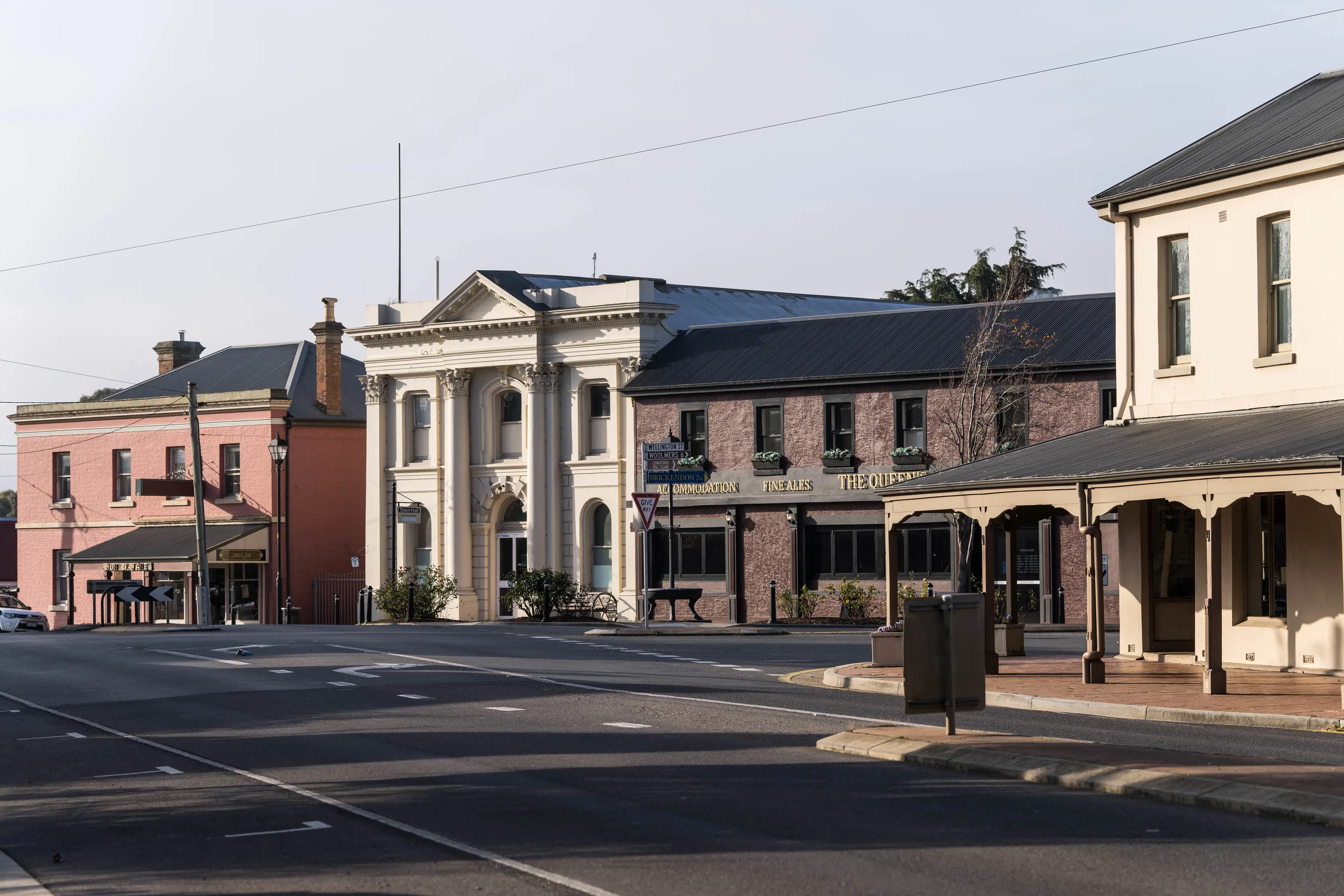 Streetscape of Wellington St, Longford, showing Longford Town Hall and The Queen's Arm Hotel.