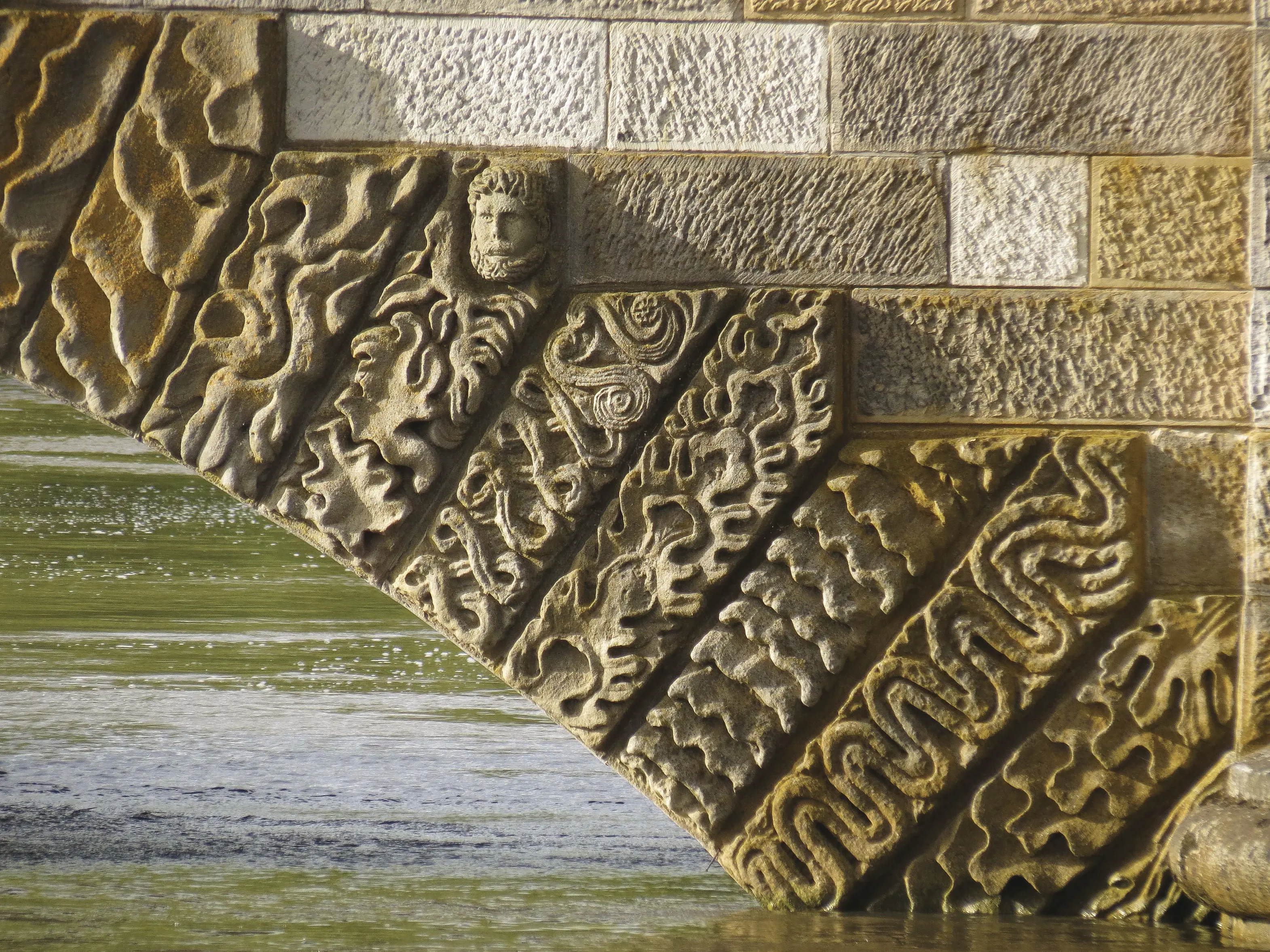 Close up of stone carvings on The Ross Bridge.