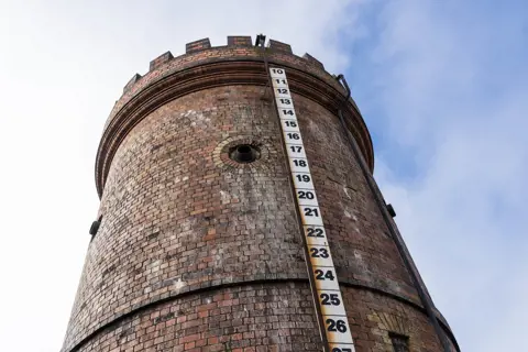Image from the ground looking up at the Stone Water Tower, Evandale.