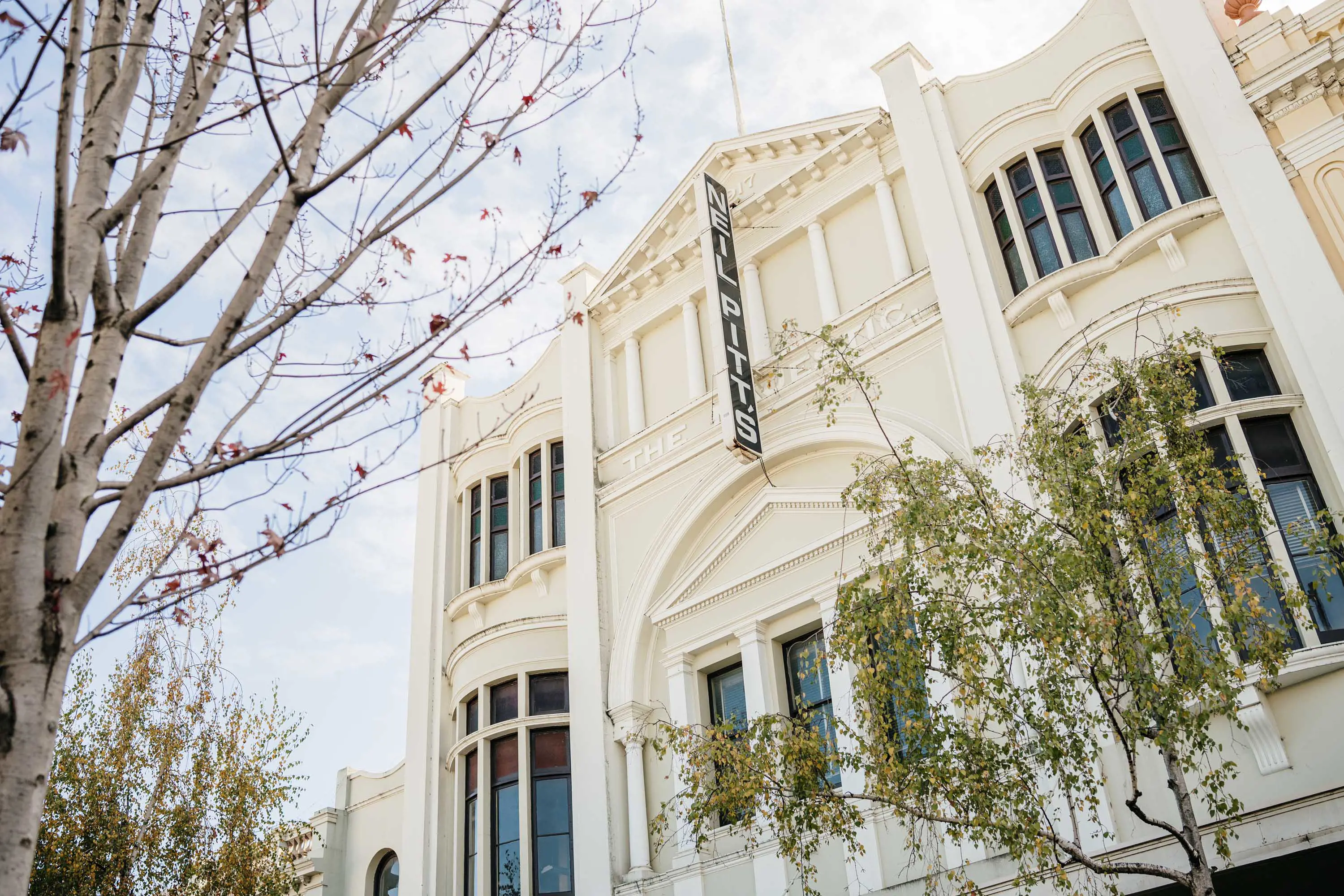 A cream-coloured building with art deco styling.