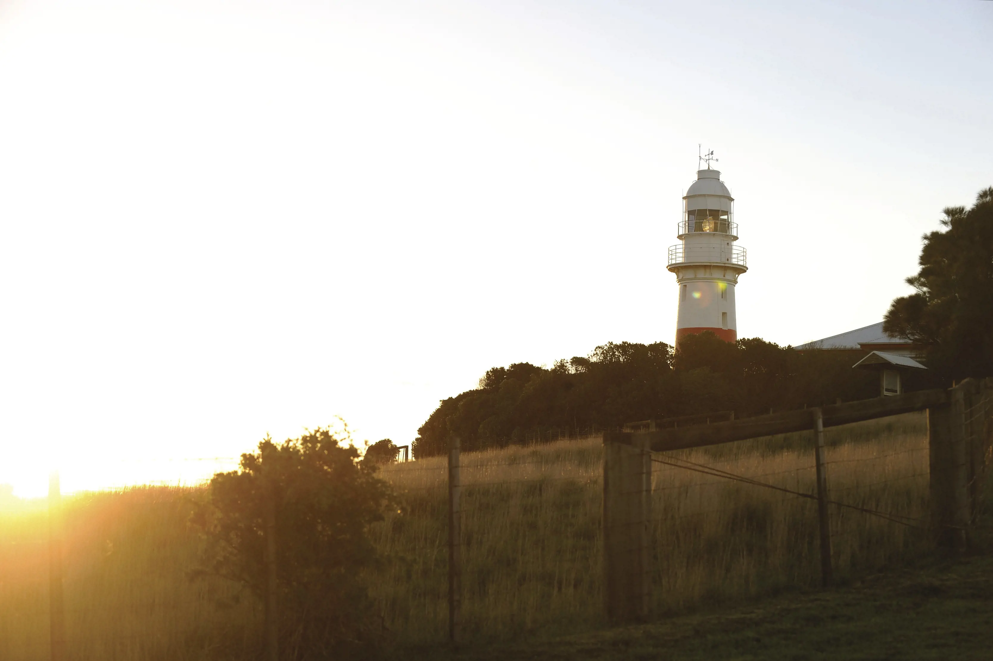 The sub beams over Low Head Lighthouse.