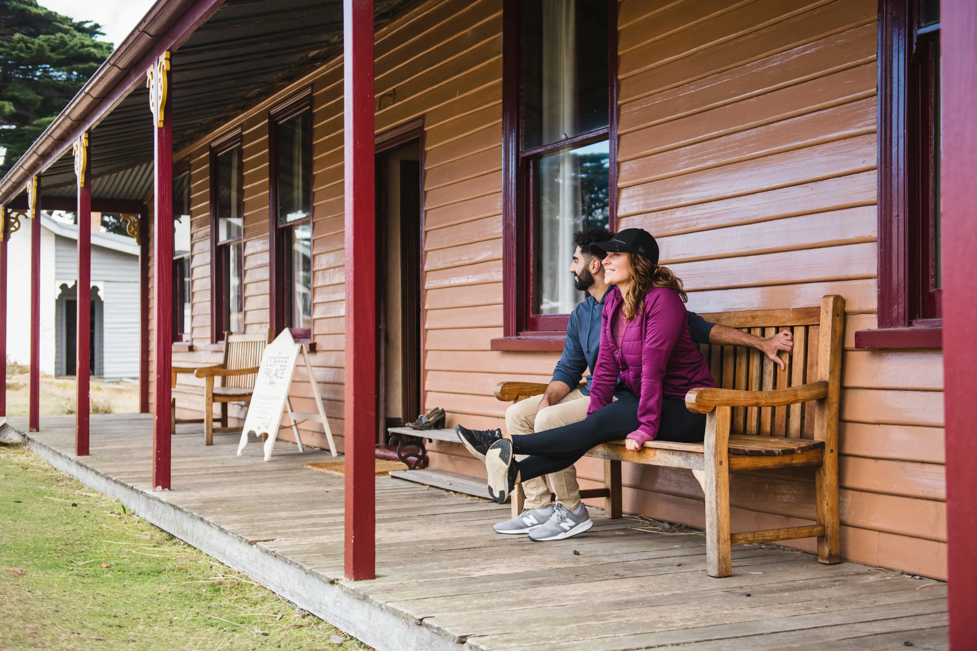 Couple sitting on an old chair at the Darlington Probation Station.