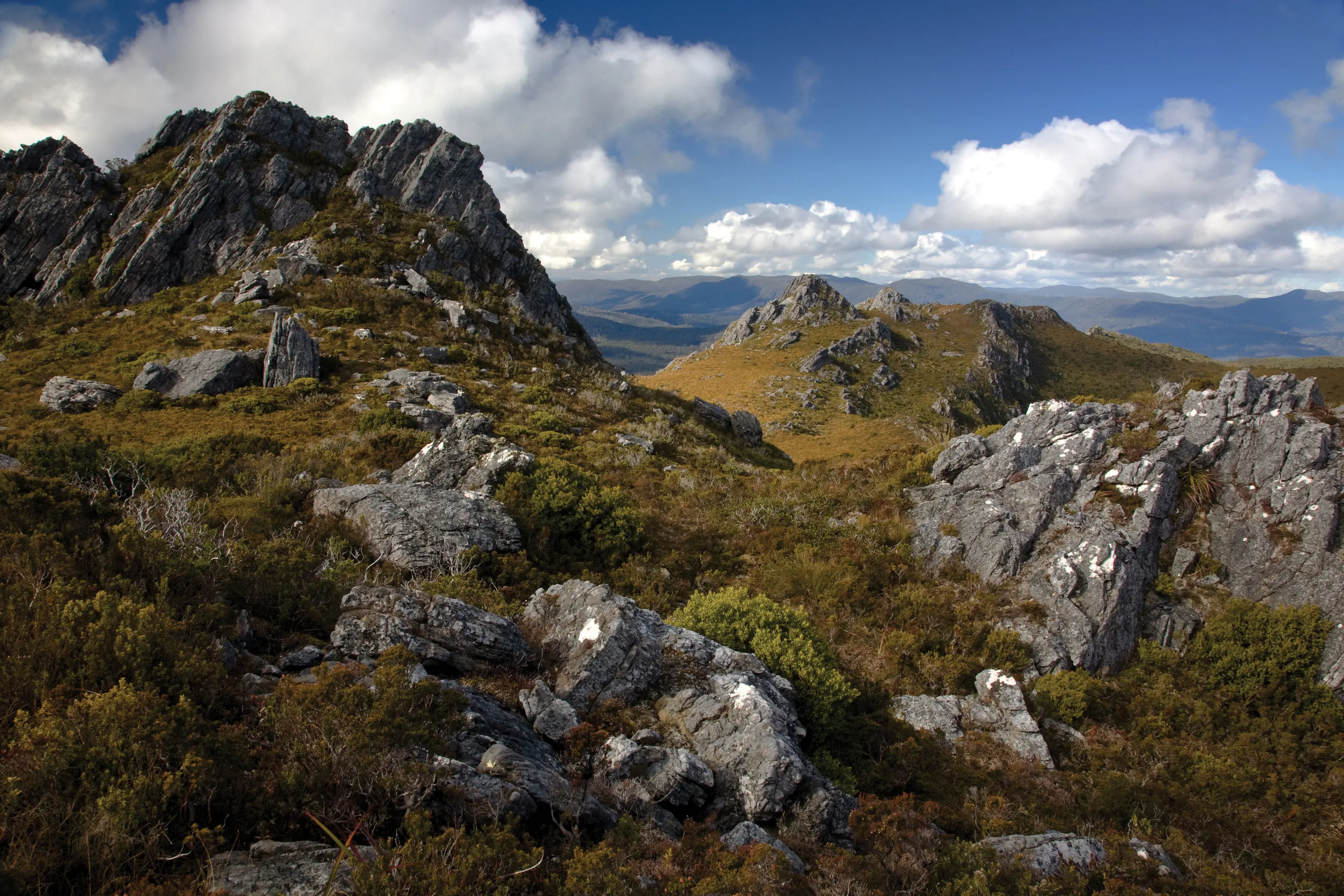 Incredible rugged landscape with bushland and large rocks scattered across The Needles, Southwest National Park.