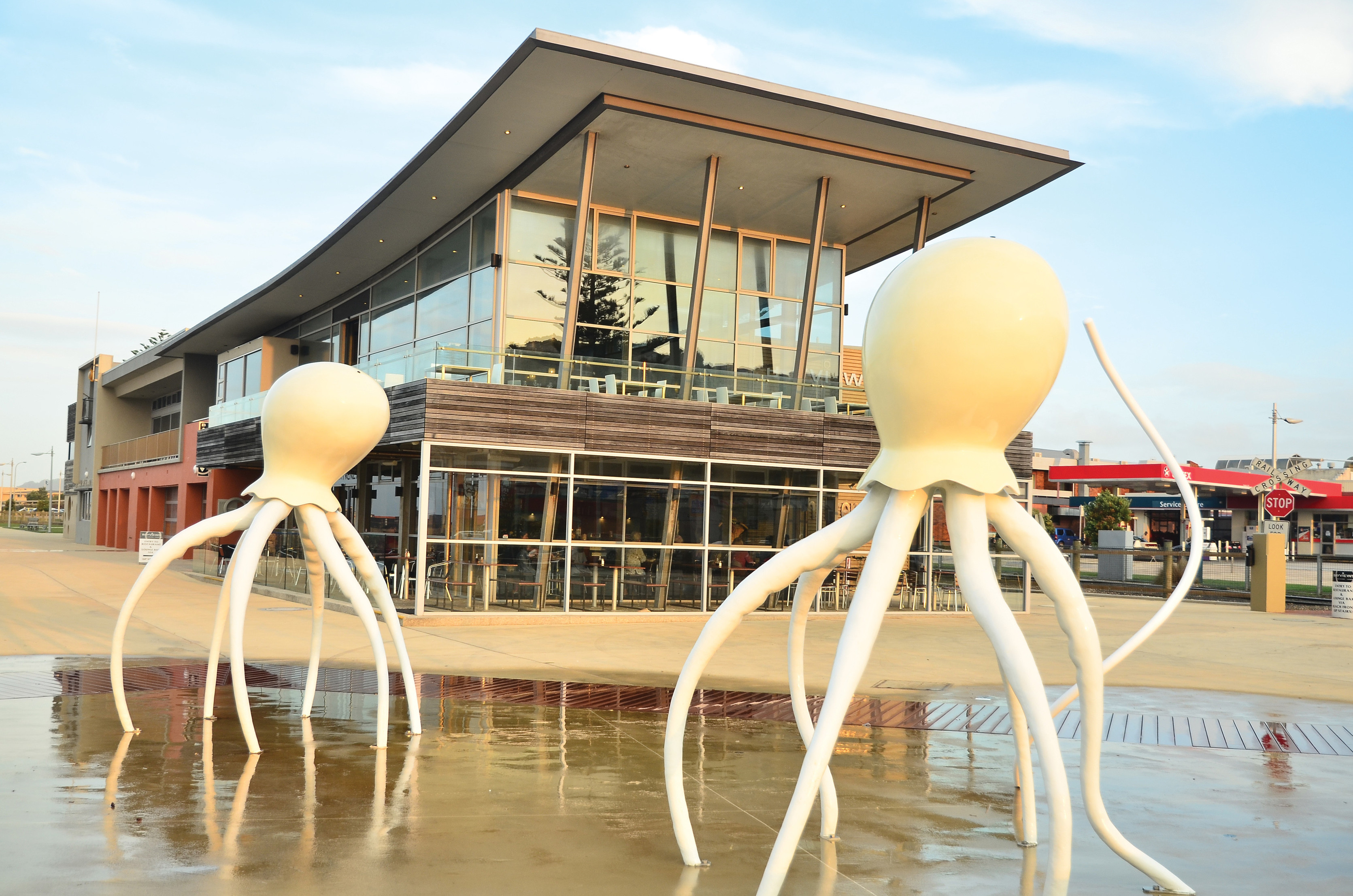 Statues of octopus, standing in front of the.Burnie Surf Club.