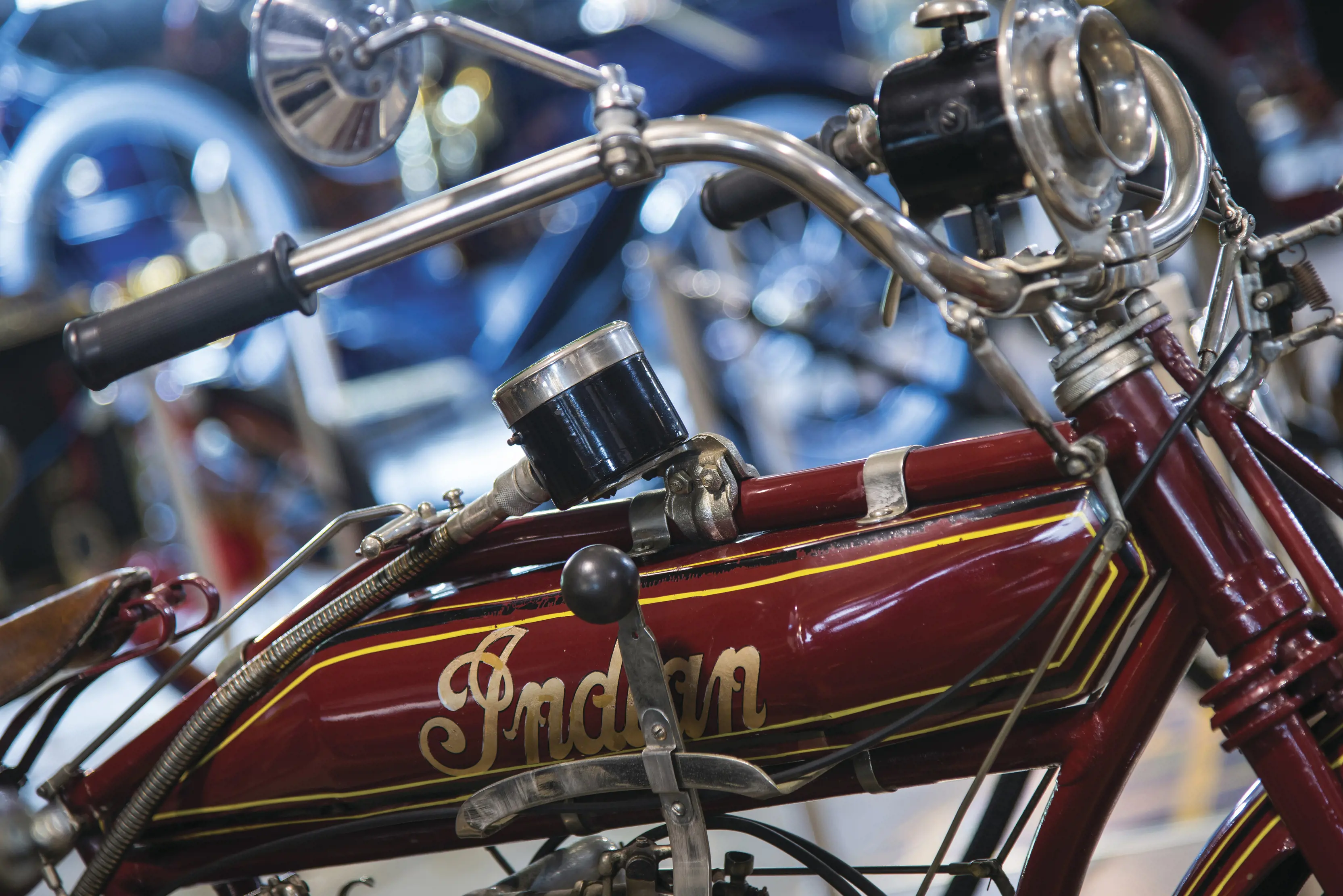 Close up image of a maroon coloured, vintage  "Indian" motorcycle. Apart of the Wonders of Wynyard - Ransley Veteran Ford Collection.