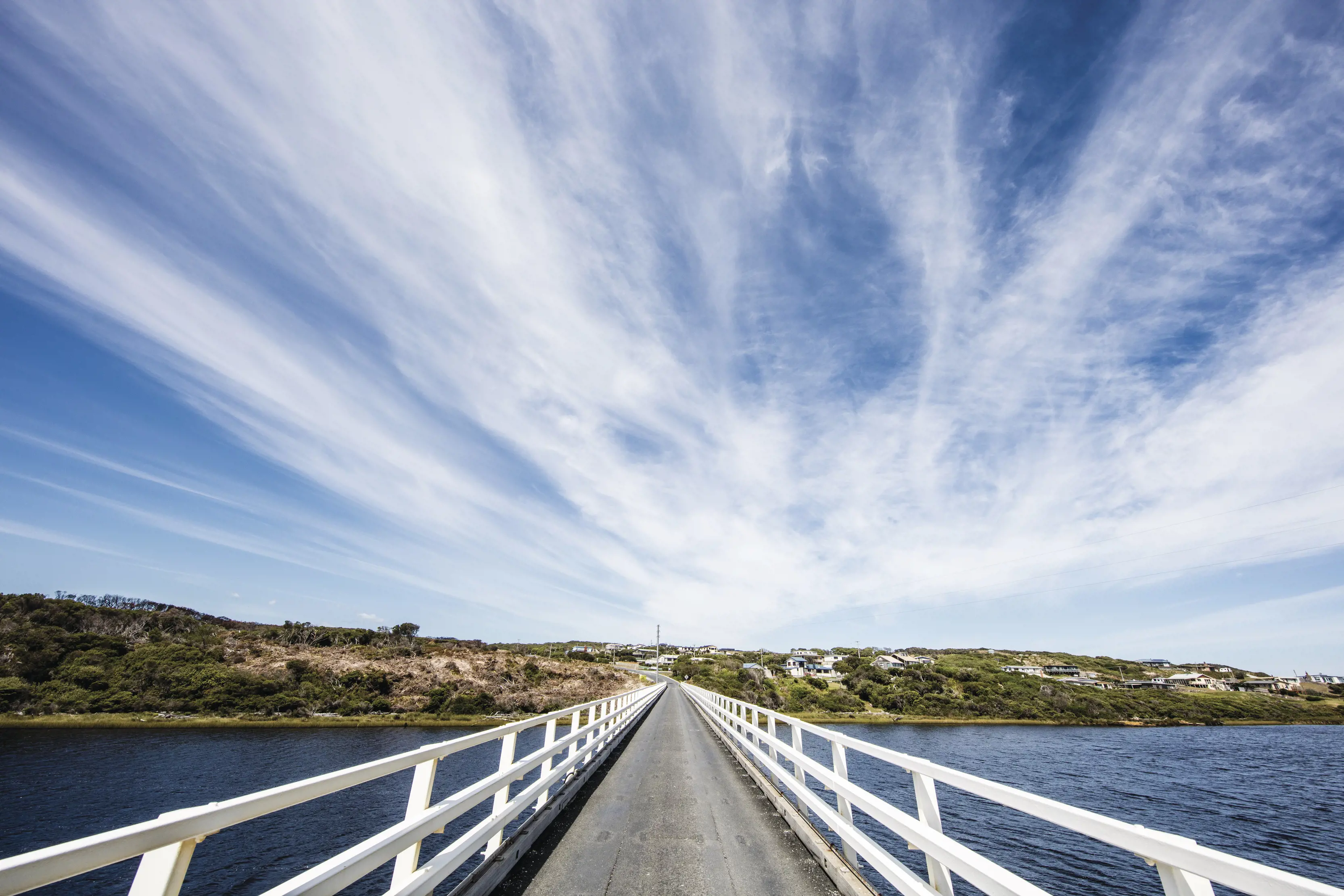 A wide angle image captured on the Arthur River Bridge, captured on a sunny day.