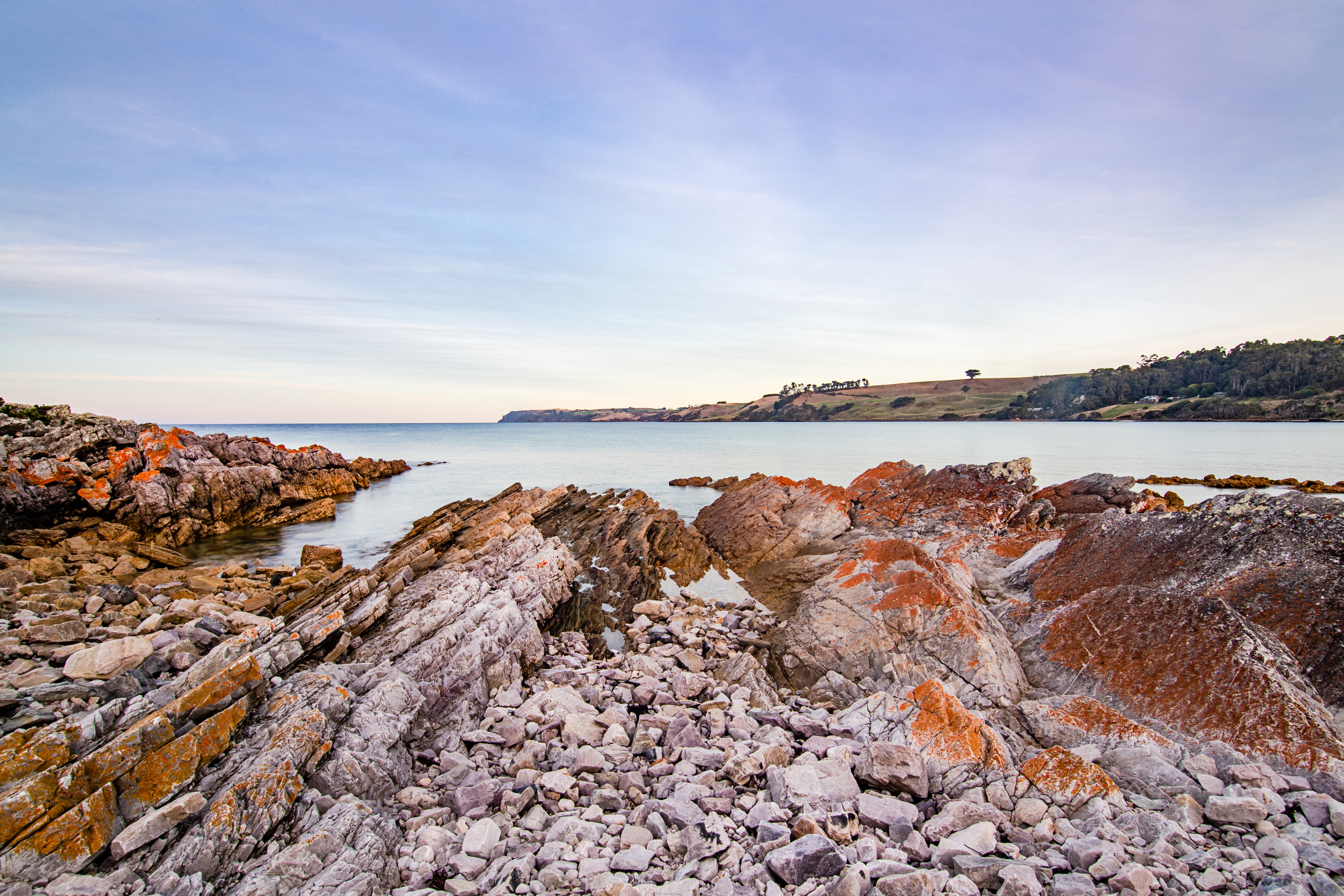 Wide angle image of the rocky coastline of Boat Harbour on a clear afternoon.