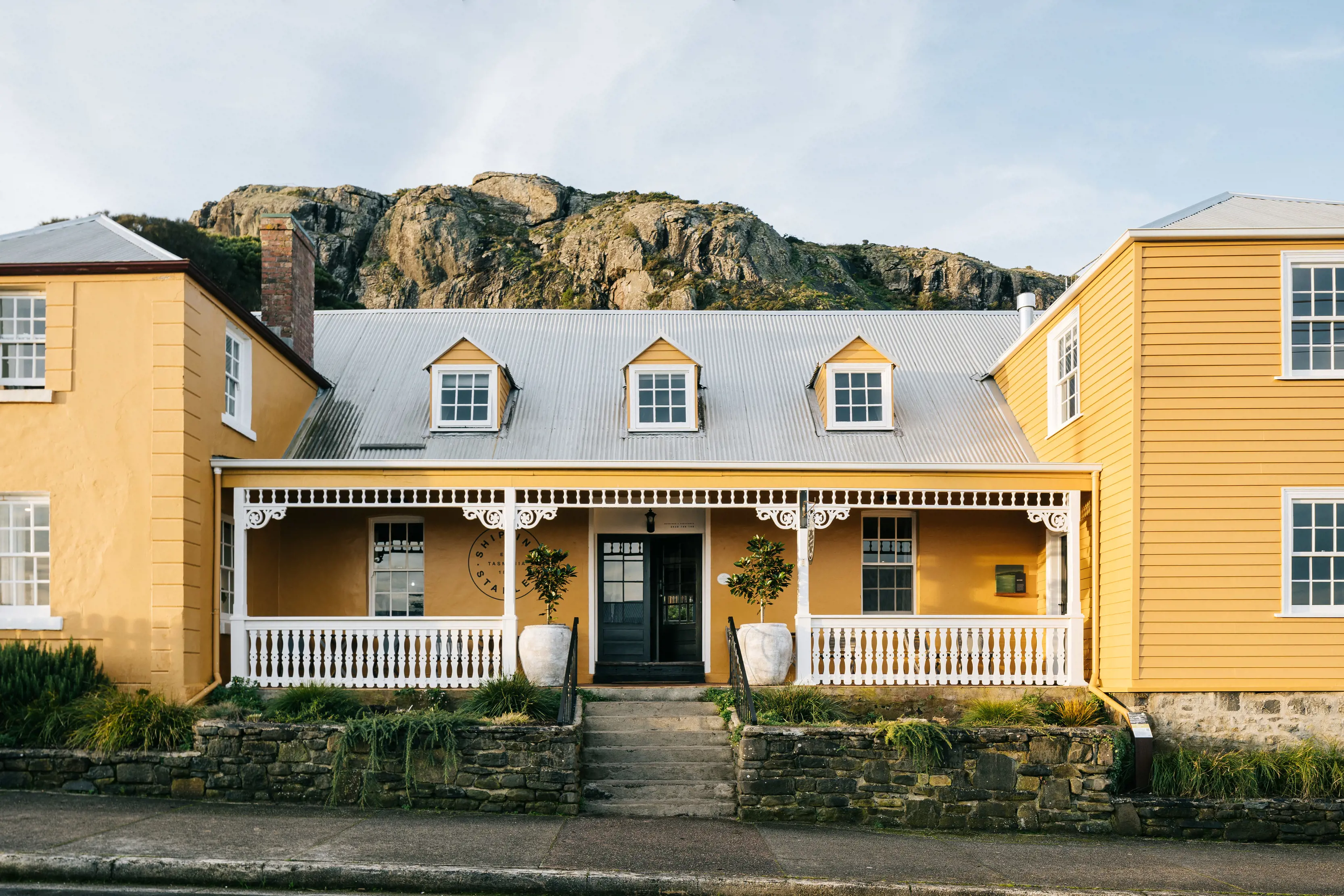 Vibrant image of the Ship Inn, showcasing its bright yellow exterior.