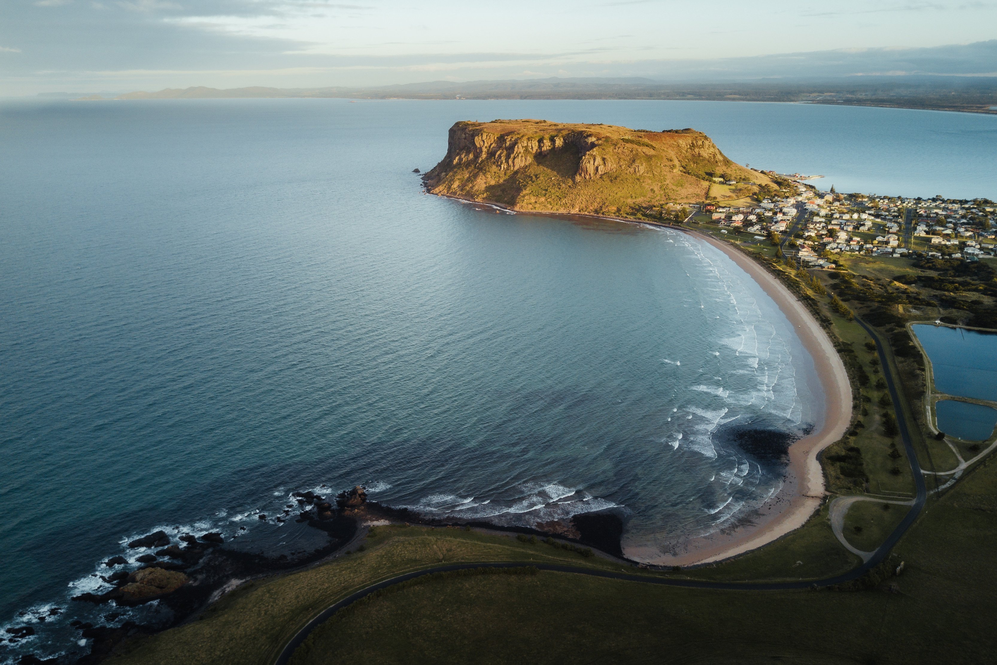 Aerial image of the stunning coastline with The Nut, a sheer-sided bluff, with the village of Stanley, nestled at the base of it