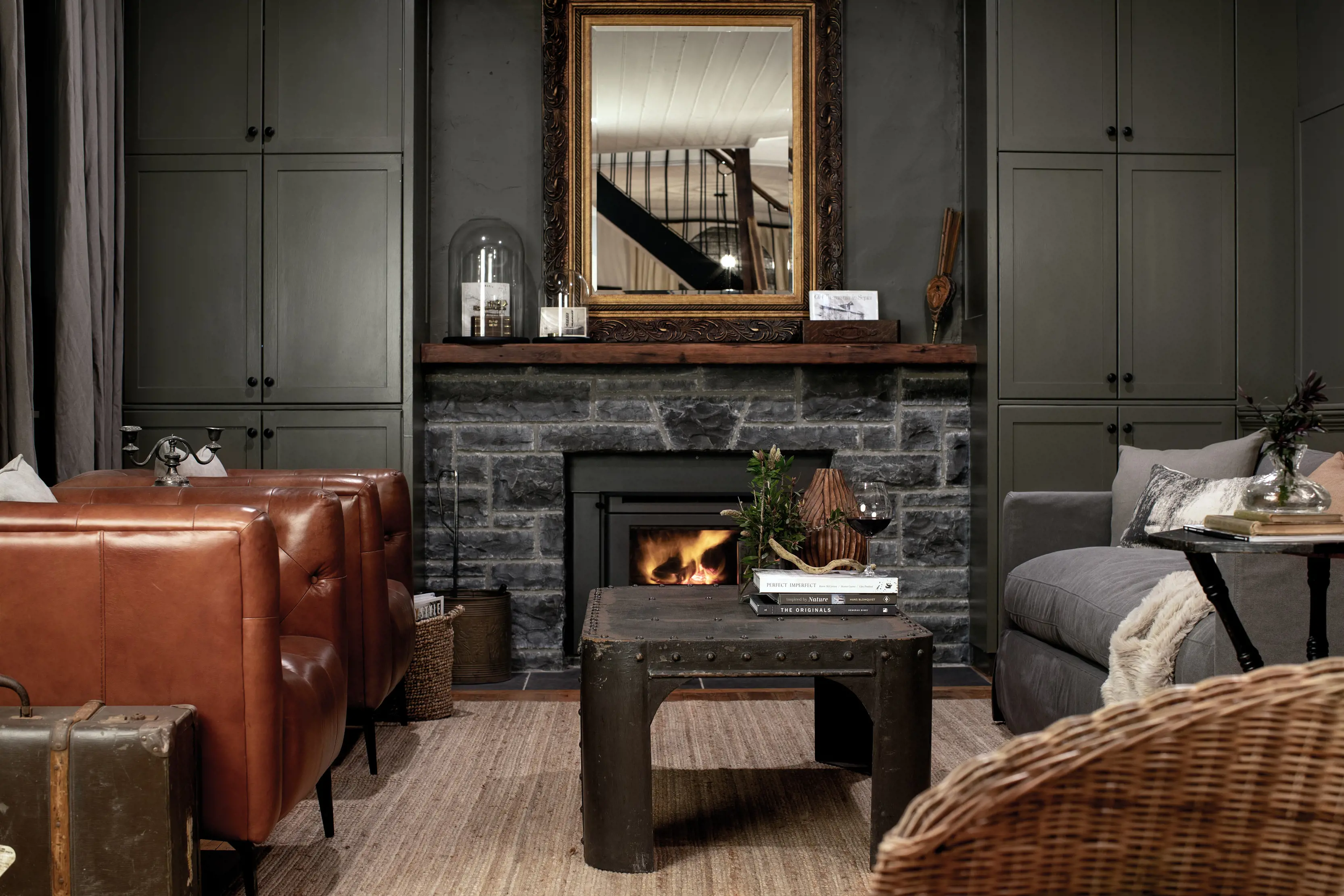 Image of inside the Ship Inn - Roaring Tom's Apartment. Vintage furniture and neutral tones fill the apartment.