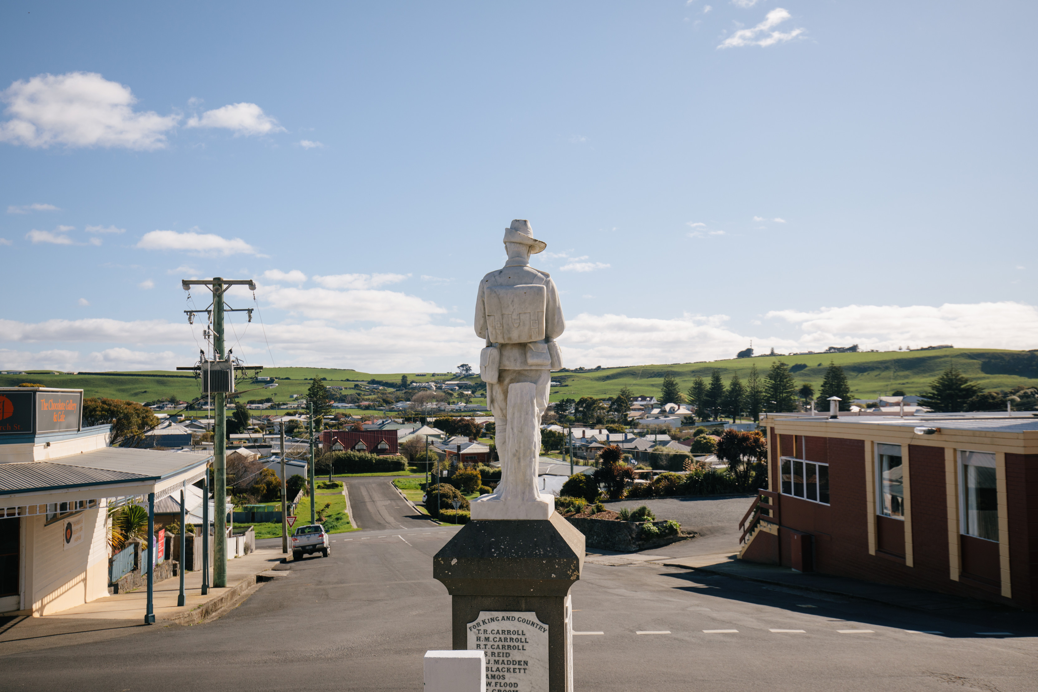 A statue of a soldier sits in the centre of Stanley village.
