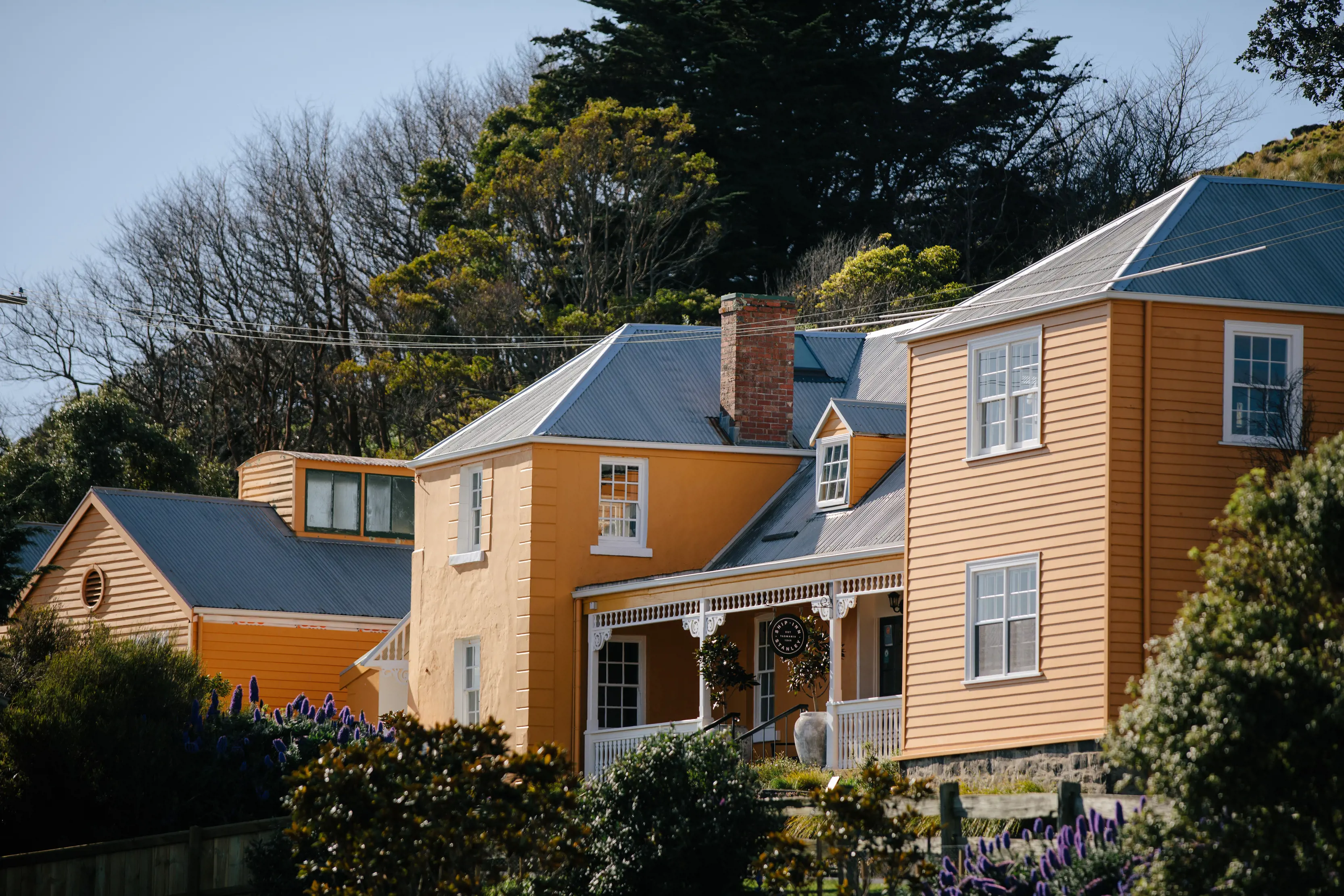 Vibrant image of the Ship Inn, showcasing its bright yellow exterior.