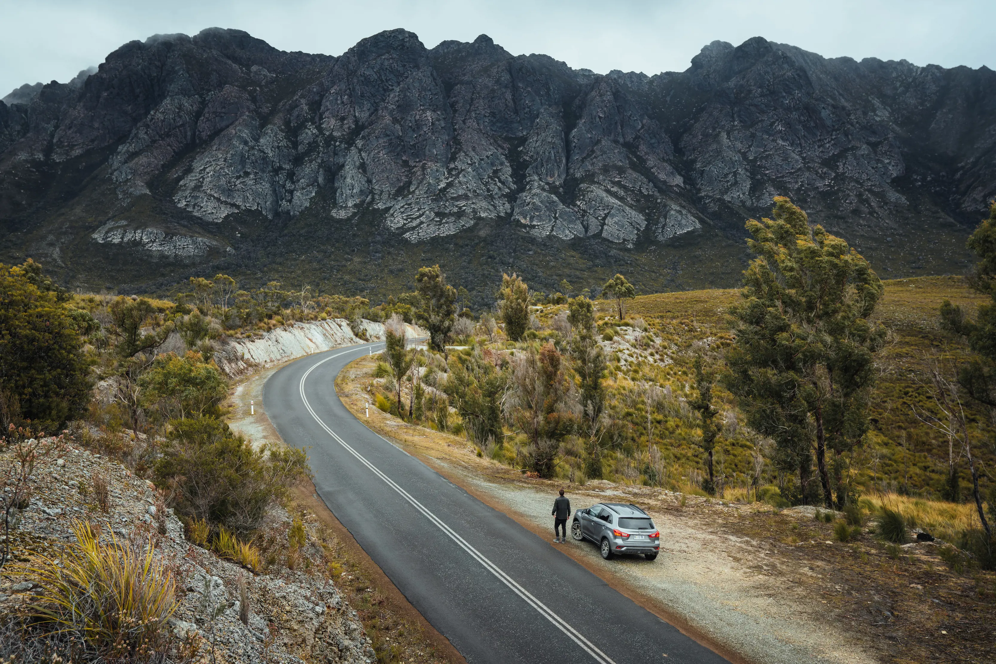 A traveller parks up and admires the views whilst on the road to Sentinel Range, a quartzite mountain range.