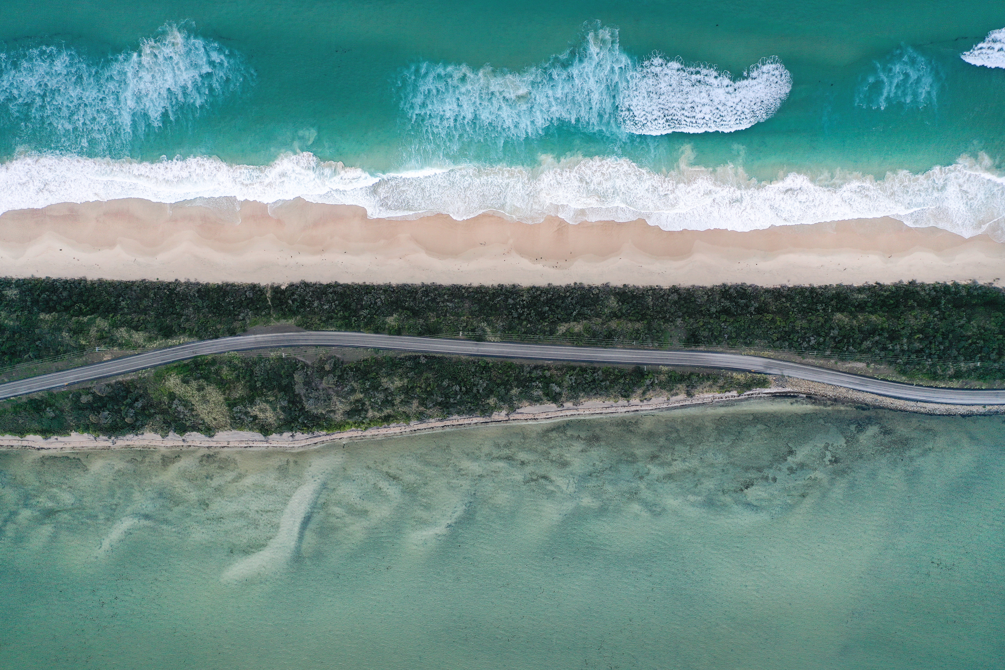 Overhead shot of the ocean, beach and road at The Neck - Bruny Island.
