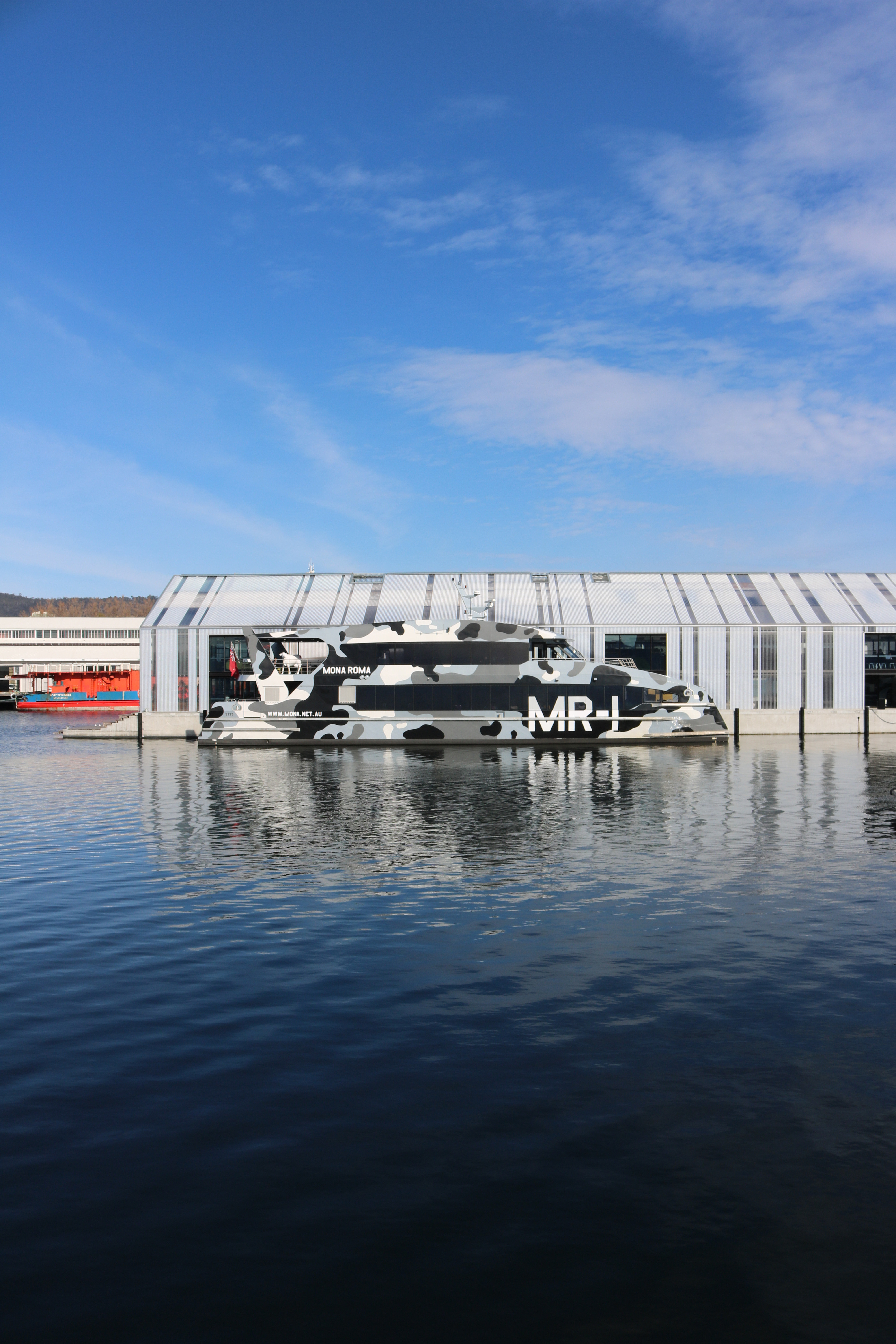 MONA Roma 1, a boat designed by makers Incat and graphic designer Damian Scott, parked up at Brooke Street Pier, Hobart