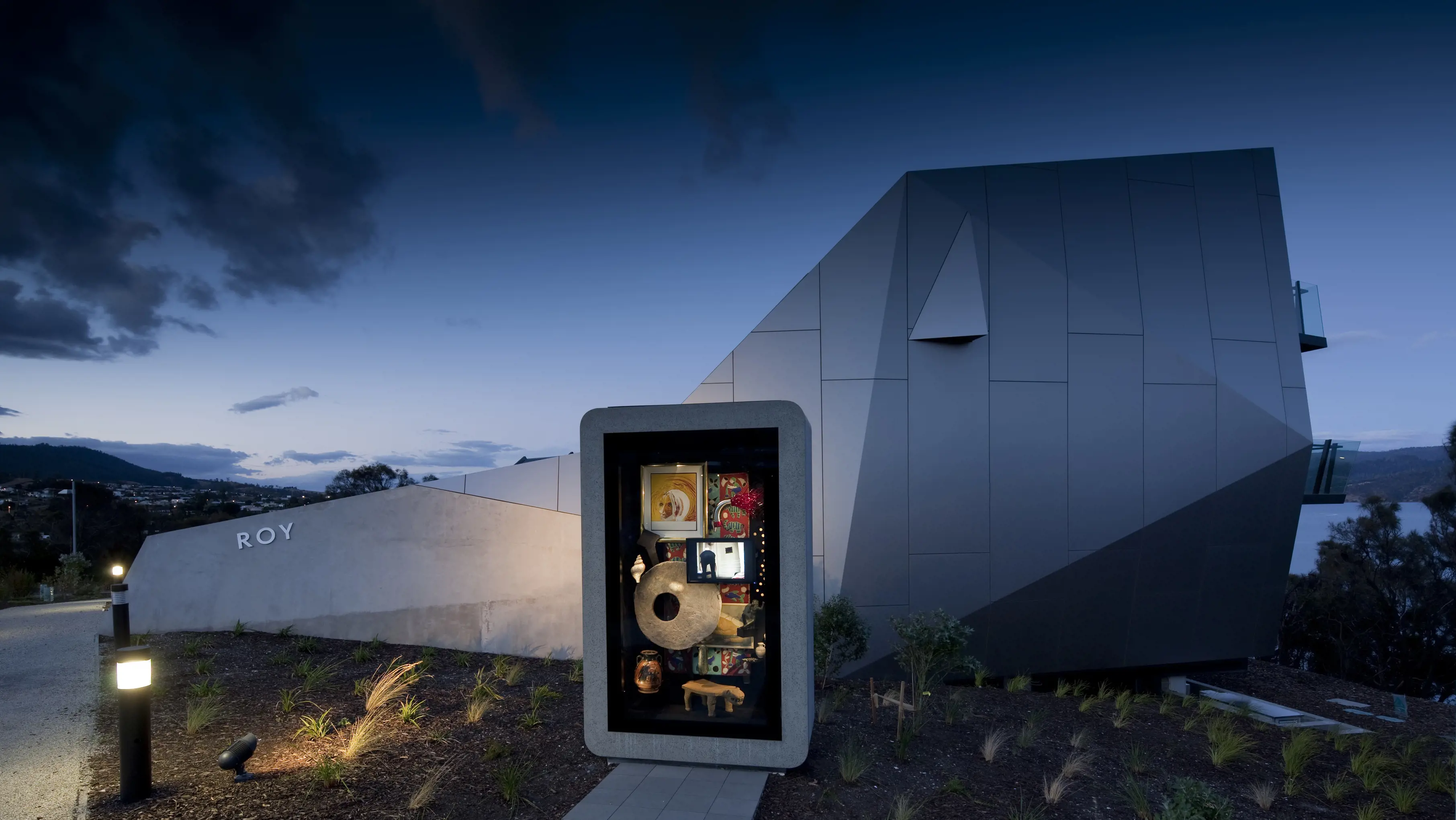 Cabinet of curiosities in the foreground of The Outdoor Wunderkammer and Roy Pavilion, Mona Pavilions.