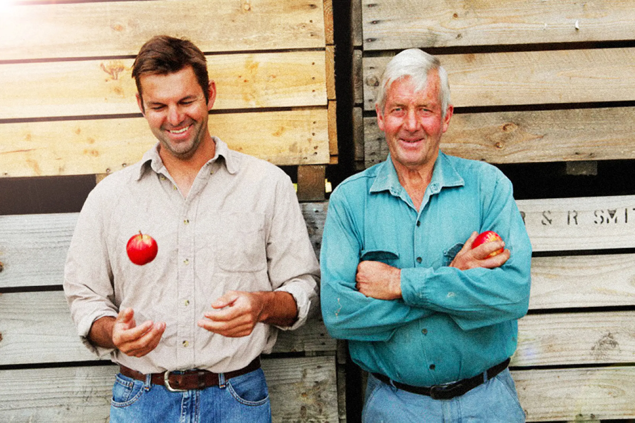 "Portrait of the owners with one throwing up an apple. One of Australia’s first organic Cidery from the Huon Valley. "