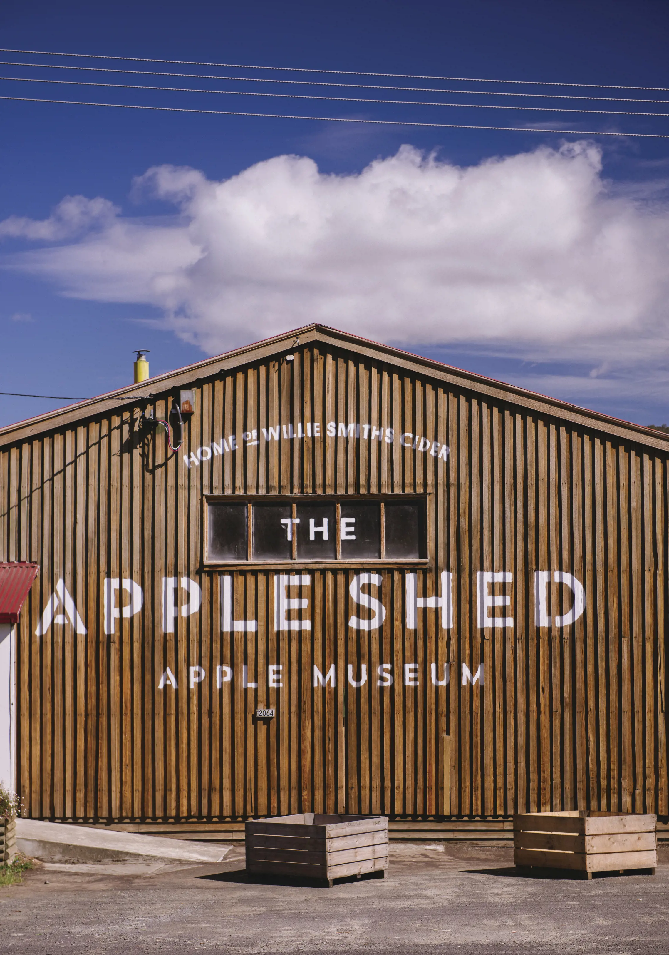 Close up image of the front of Willie Smiths Organic Apple Cider, taken outside on a sunny day.