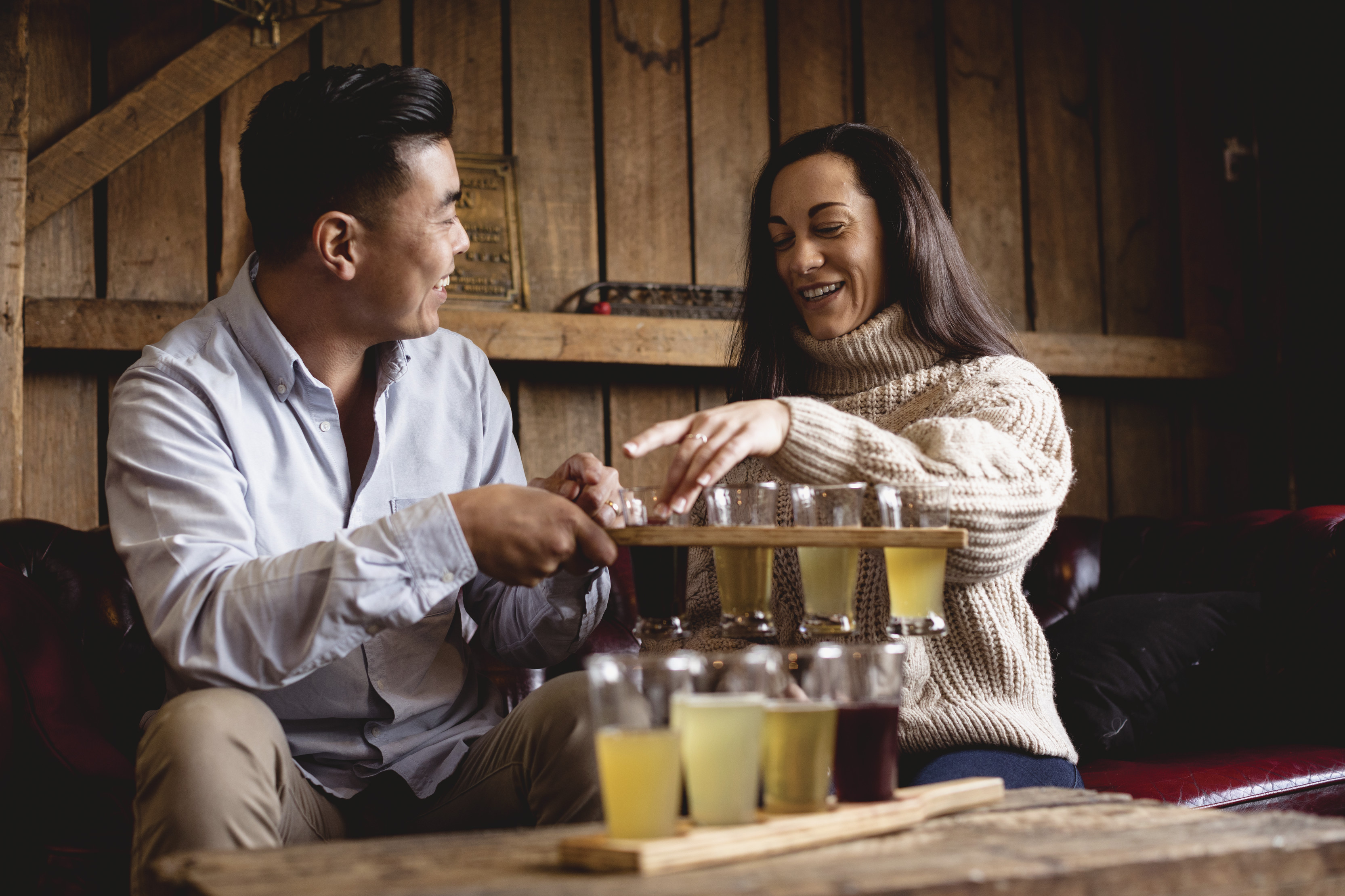 Couple tasting a variety of of ciders at the Willie Smith's Apple Shed.