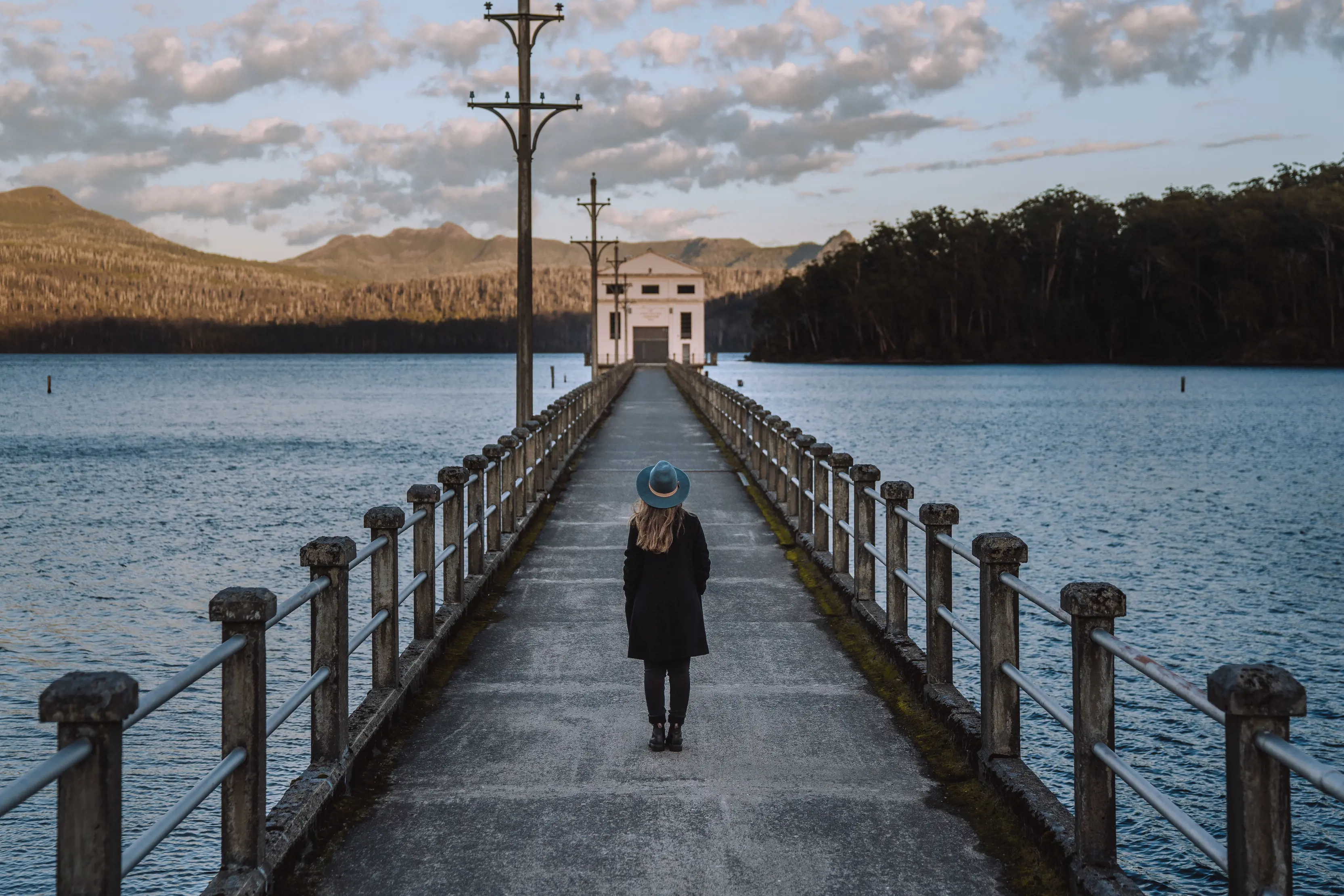Stunning wide angle image of a person walking along a walkway out to Pumphouse Point, among Lake St Claire.
