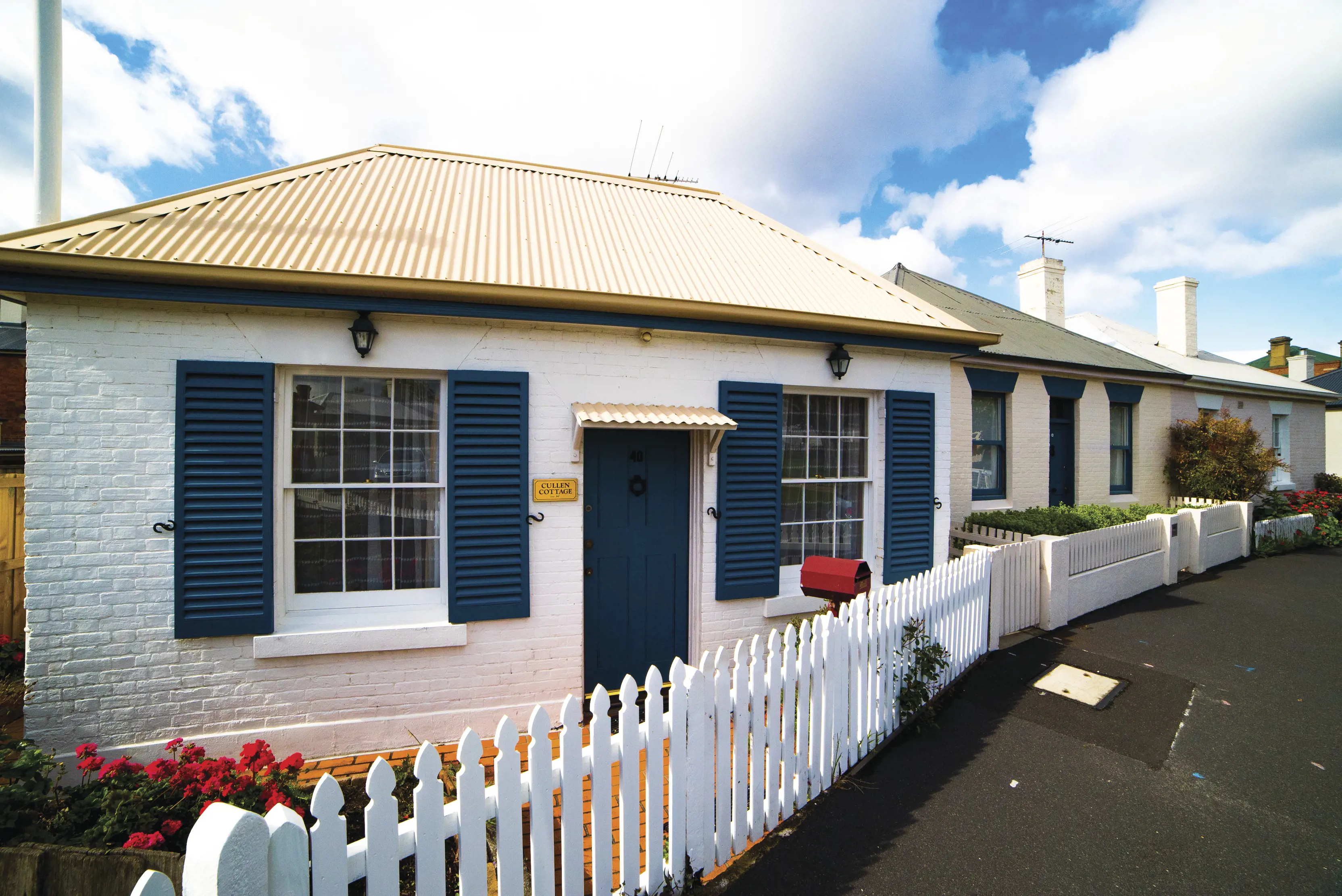 Close up of a cottage at Arthur Circus, a ring of historic cottages located in Battery Point.