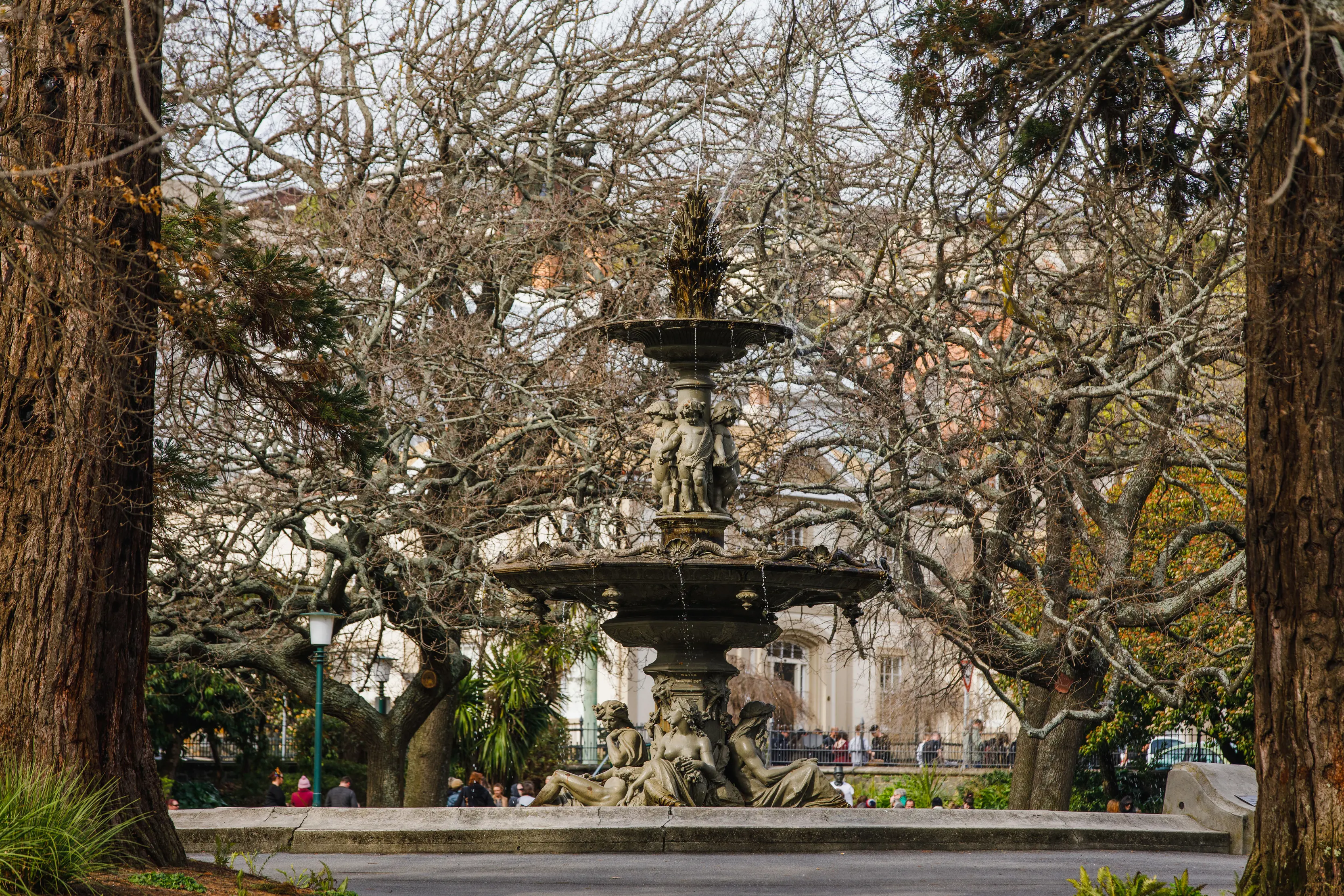 Historic Princes Park featuring mature trees and a fountain.