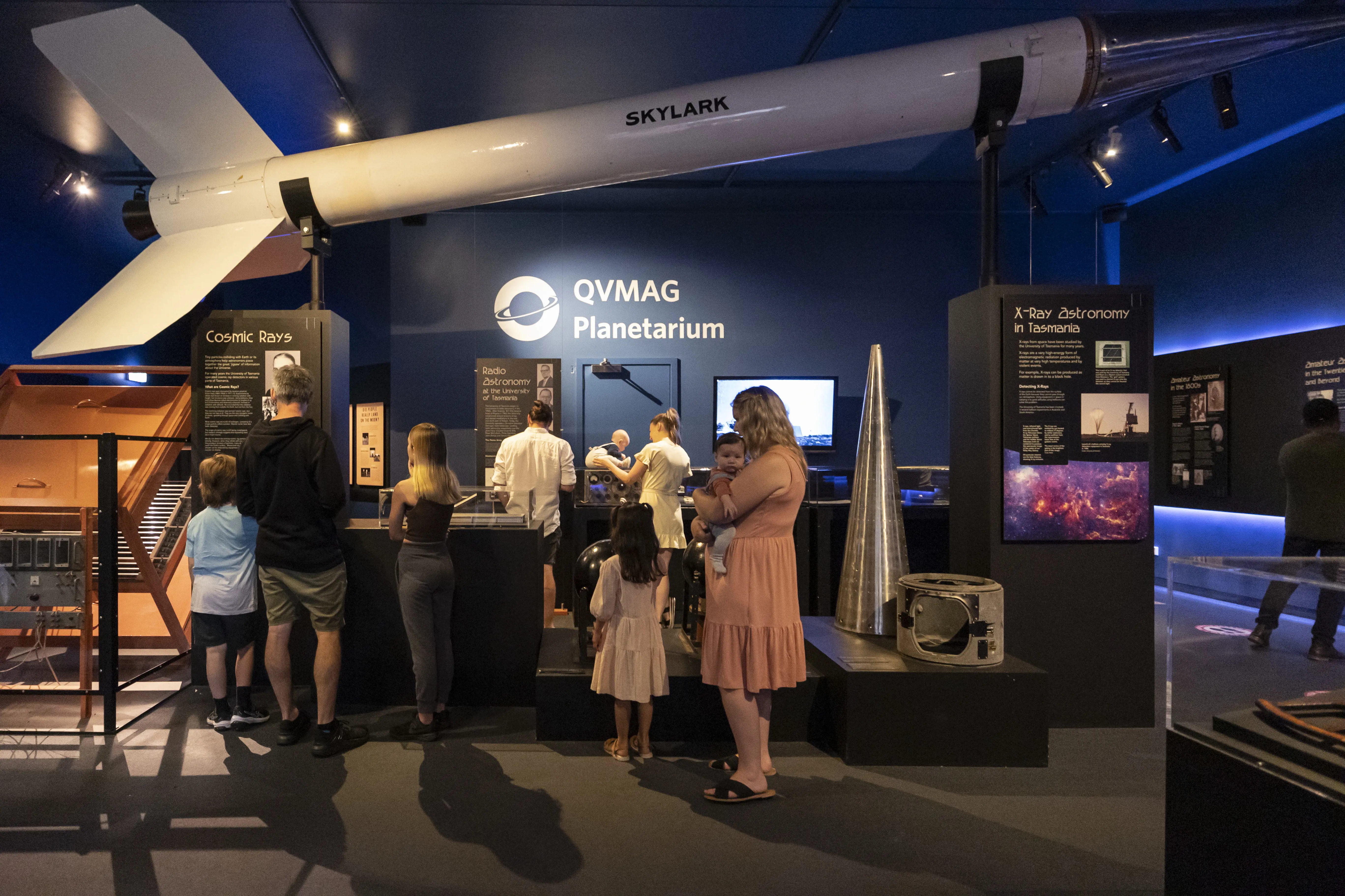 Families explore the exhibition space in front of the QVMAG Planetarium entrace.